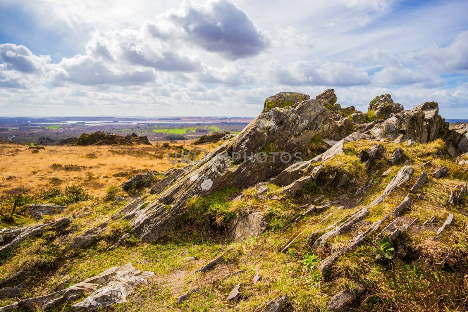 Beautiful panorama from the rocky highest point of Bretagne over moors and hills. Roch Trevezel, Monts d'Arrée, France