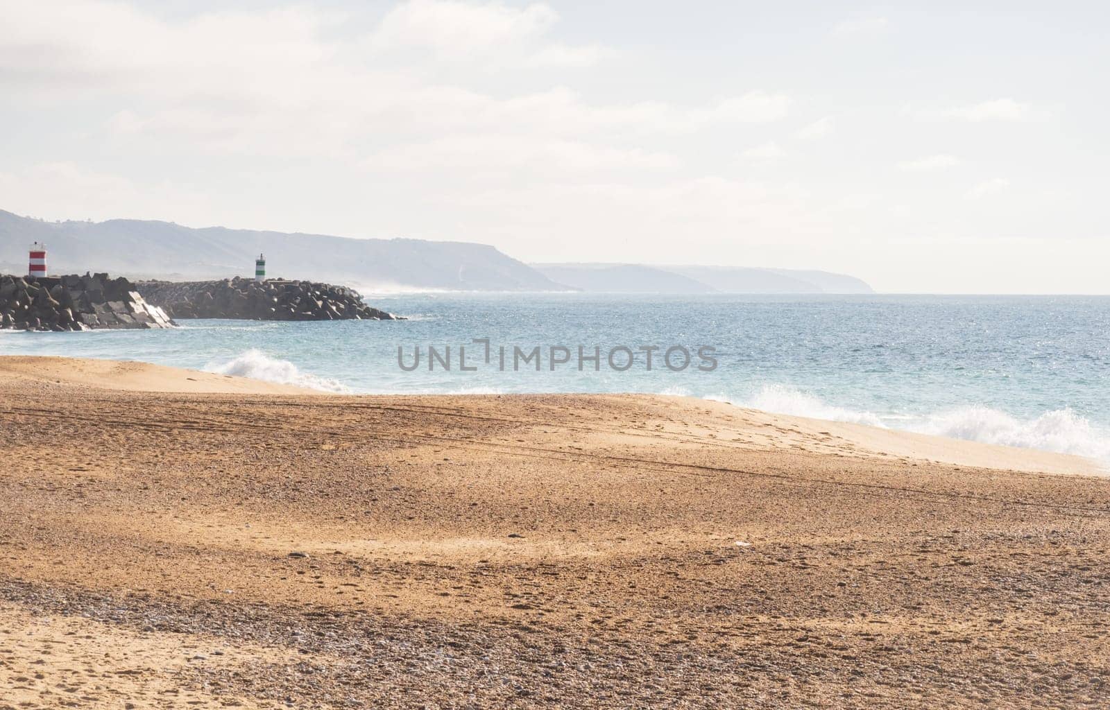 Photography taken on Praia da Nazaré beach with rough sea in Portugal, soft colors