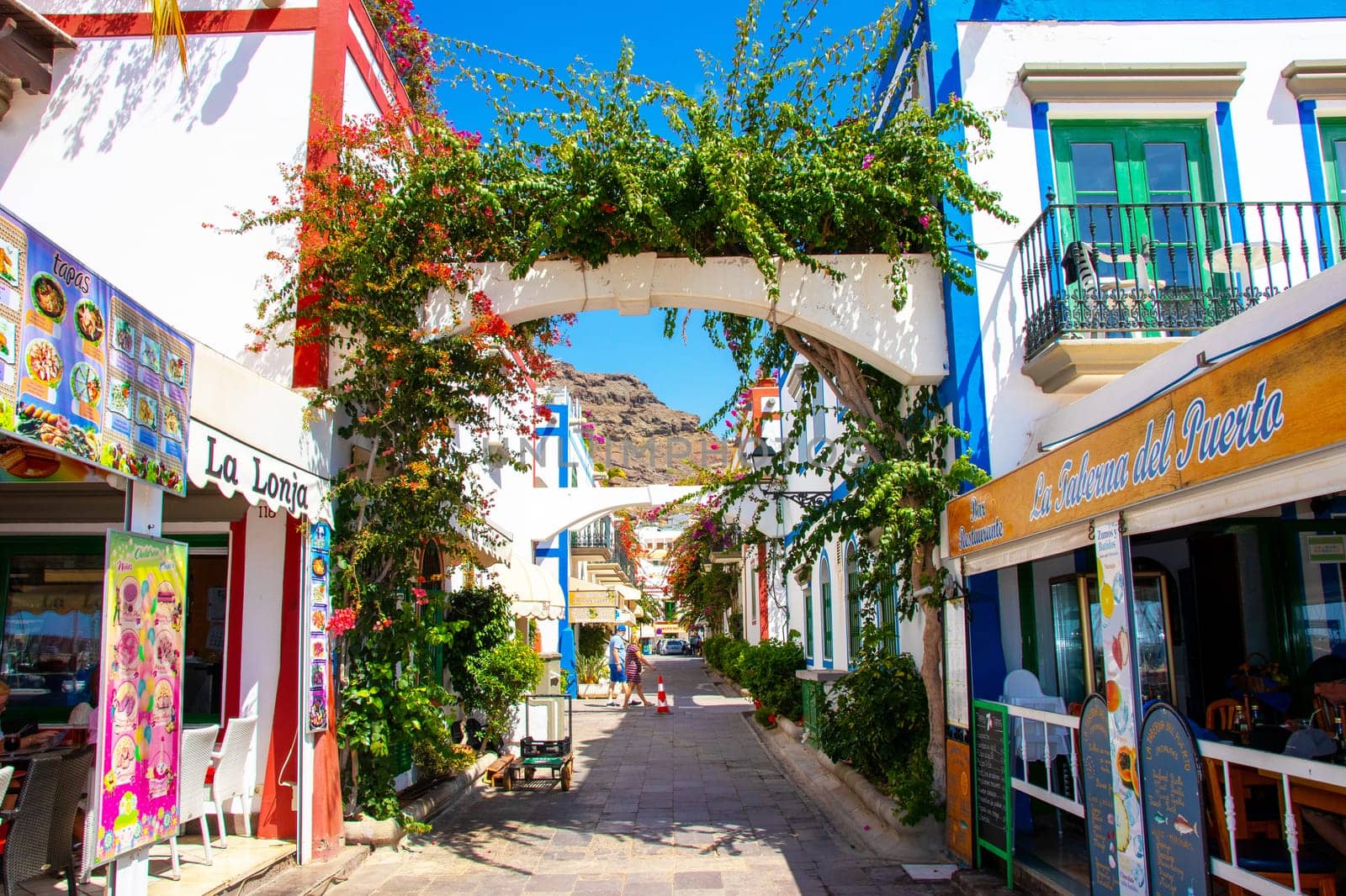 Gran Canaria, Spain, Sep 16, 2018. Puerto de Mogan, also called little Venice, with a small fishing harbour, romantic alleys and beautiful architecture. Popular town with shopping facilities, restaurants and pubs.
