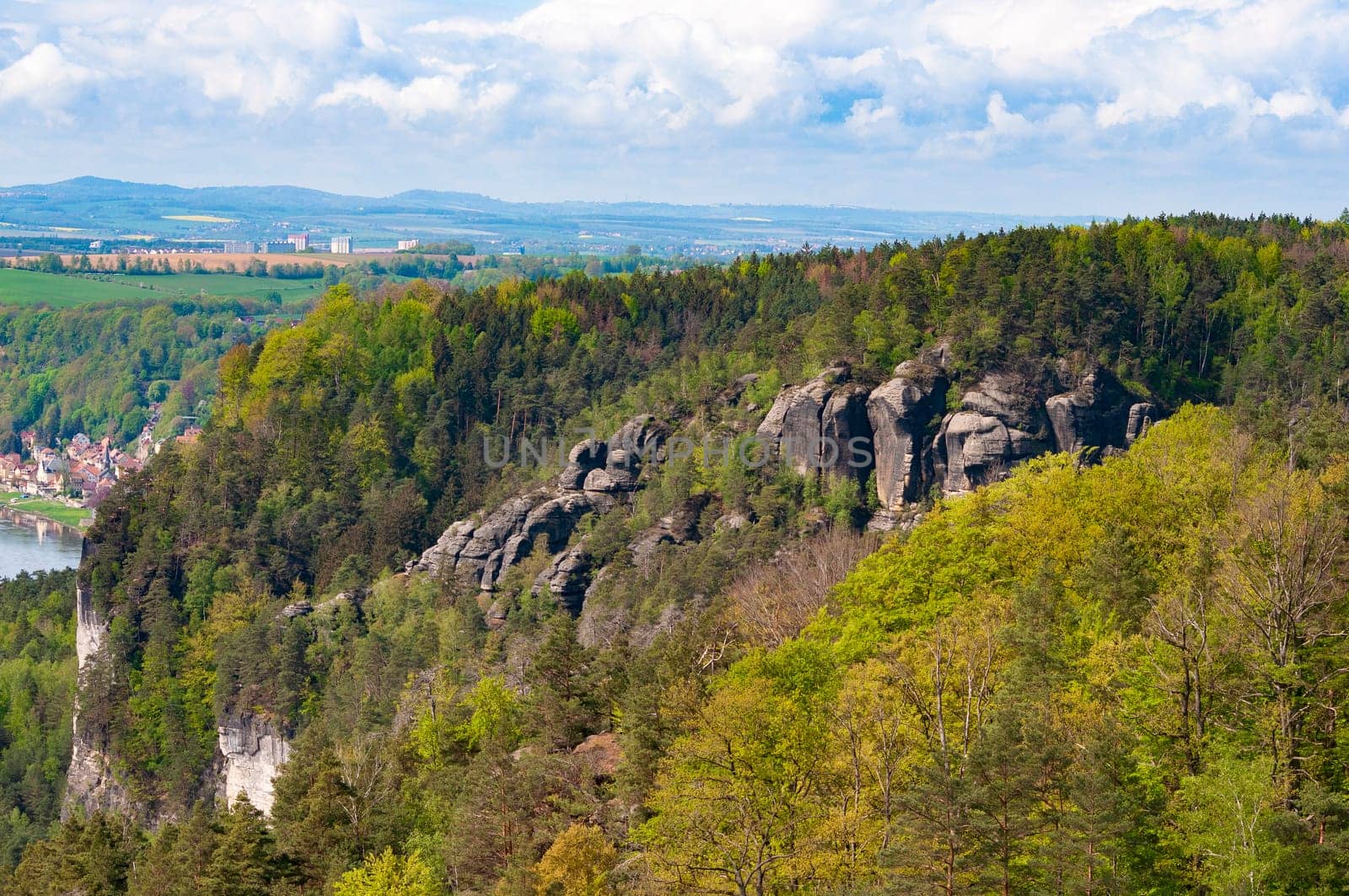 Beautiful summer view of Elbe river from Bastei view pont. Colorful morning scene of Saxon Switzerland national park, Germany, Europe. Splendid landscape of Sandstone Mountains, Saxony.