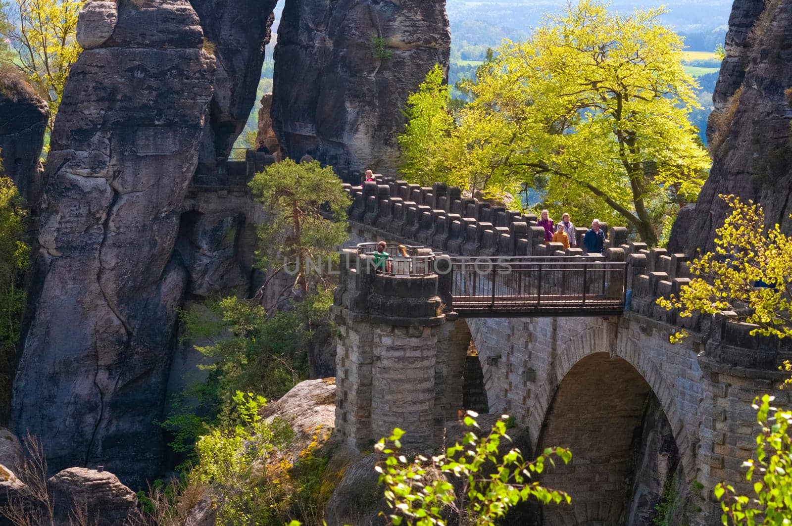 Saxon Switzerland National Park, Germany - April 19, 2124: The people going at Bastei bridge at Saxon Switzerland National Park