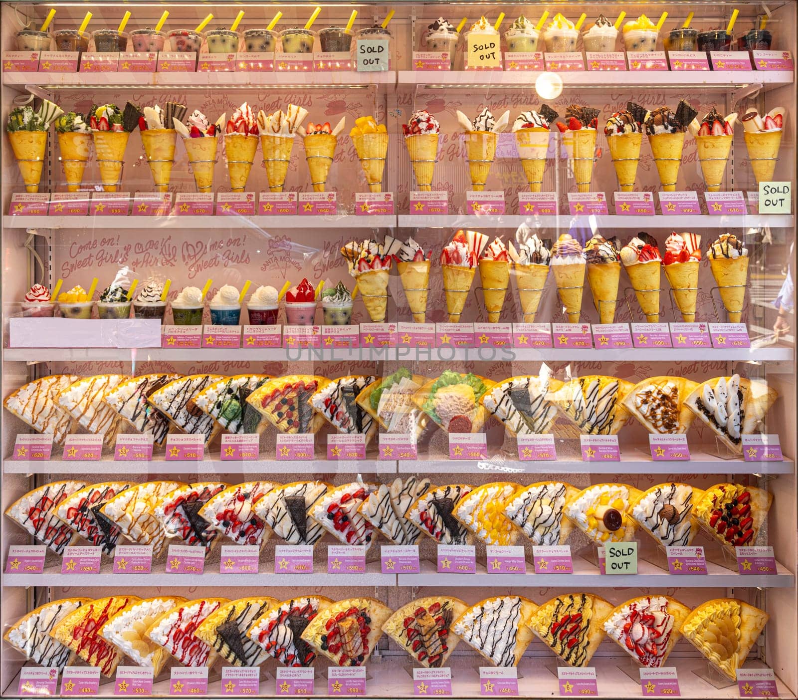 TOKYO/JAPAN - November 21, 2023:Shop window with multitude of crepes in various flavours