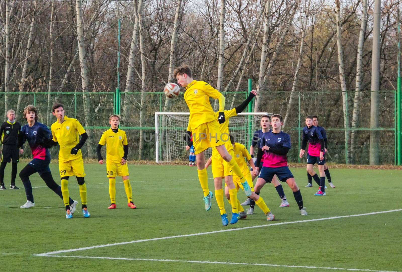Russia, Volgodonsk - may 17, 2015: Football game. Training matches junior teams and fans