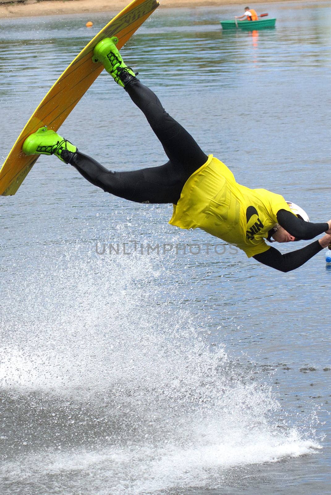 Russia, Volgodonsk - June 18, 2015: Water snowboard. The athlete with snowboard hold on to the rope and the boat accelerates.