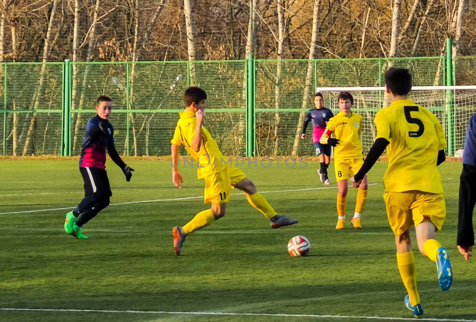 Russia, Volgodonsk - may 17, 2015: Football game. Training matches junior teams and fans