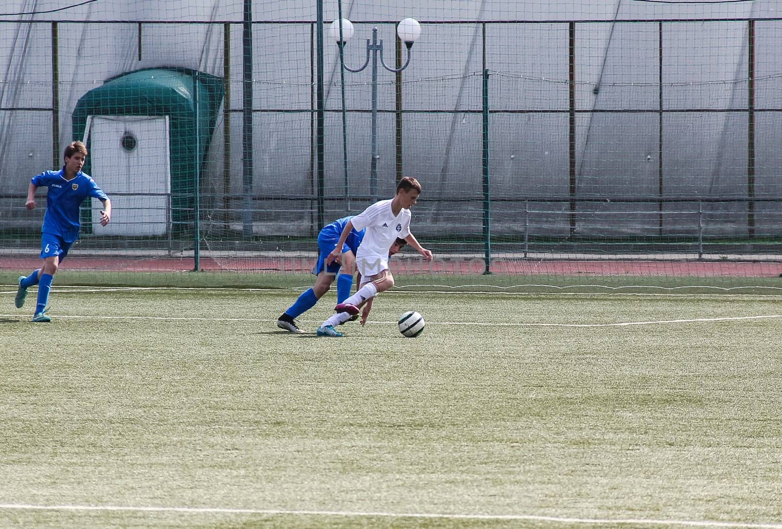 Russia, Volgodonsk - may 17, 2015: Football game. Training matches junior teams and fans