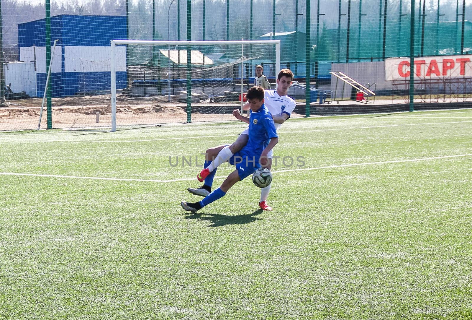 Russia, Volgodonsk - may 17, 2015: Football game. Training matches junior teams and fans