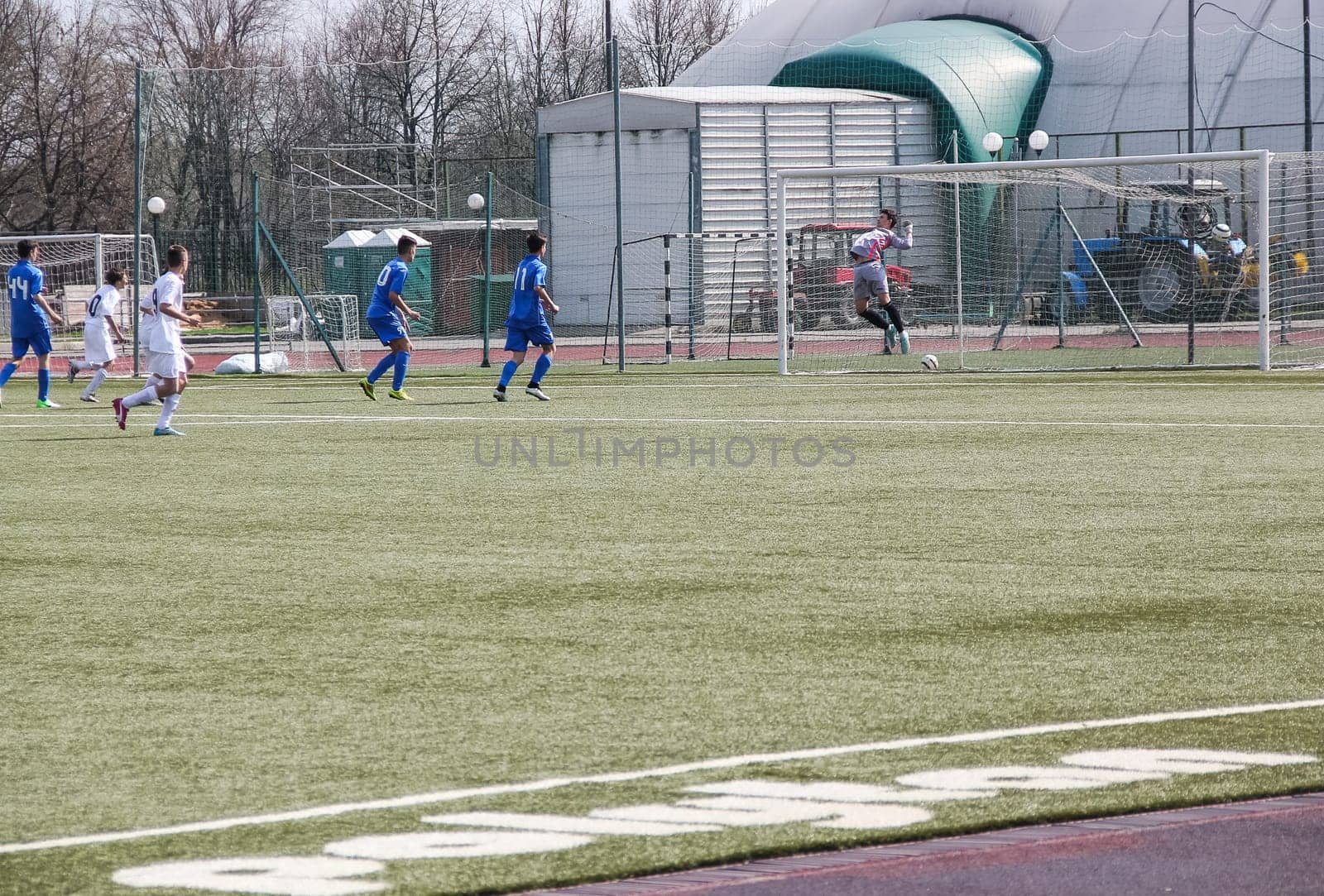 Russia, Volgodonsk - may 17, 2015: Football game. Training matches junior teams and fans