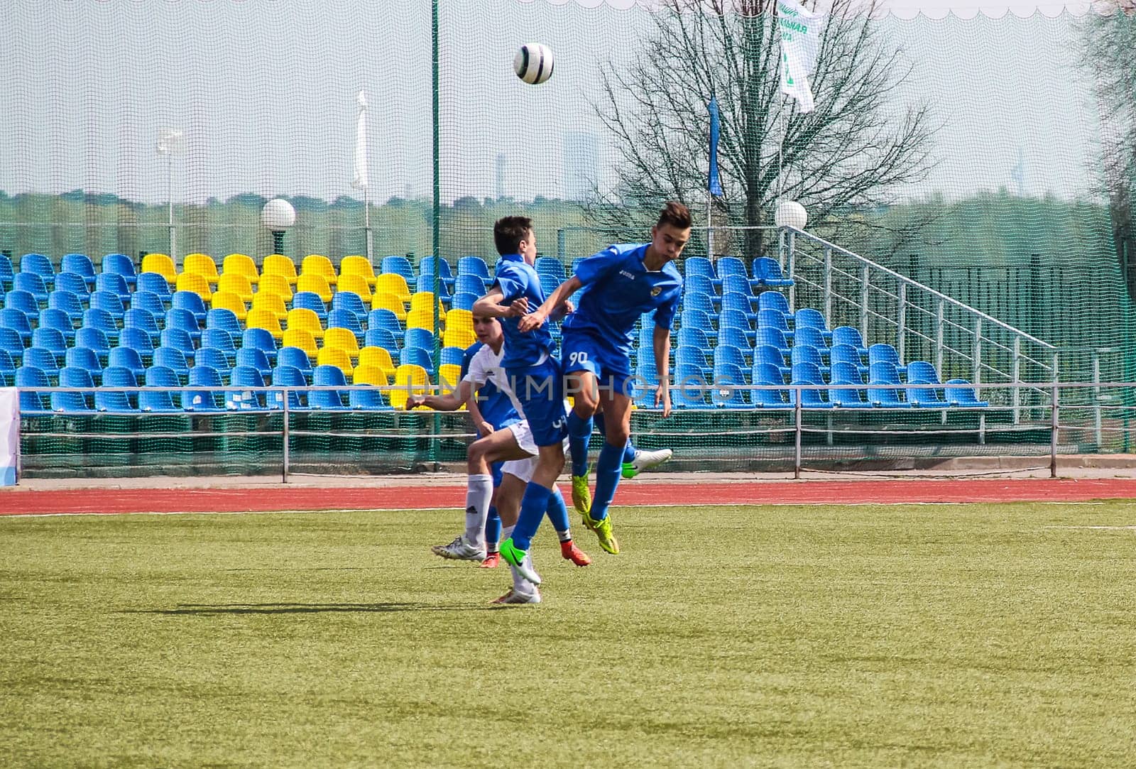 Russia, Volgodonsk - may 17, 2015: Football game. Training matches junior teams and fans