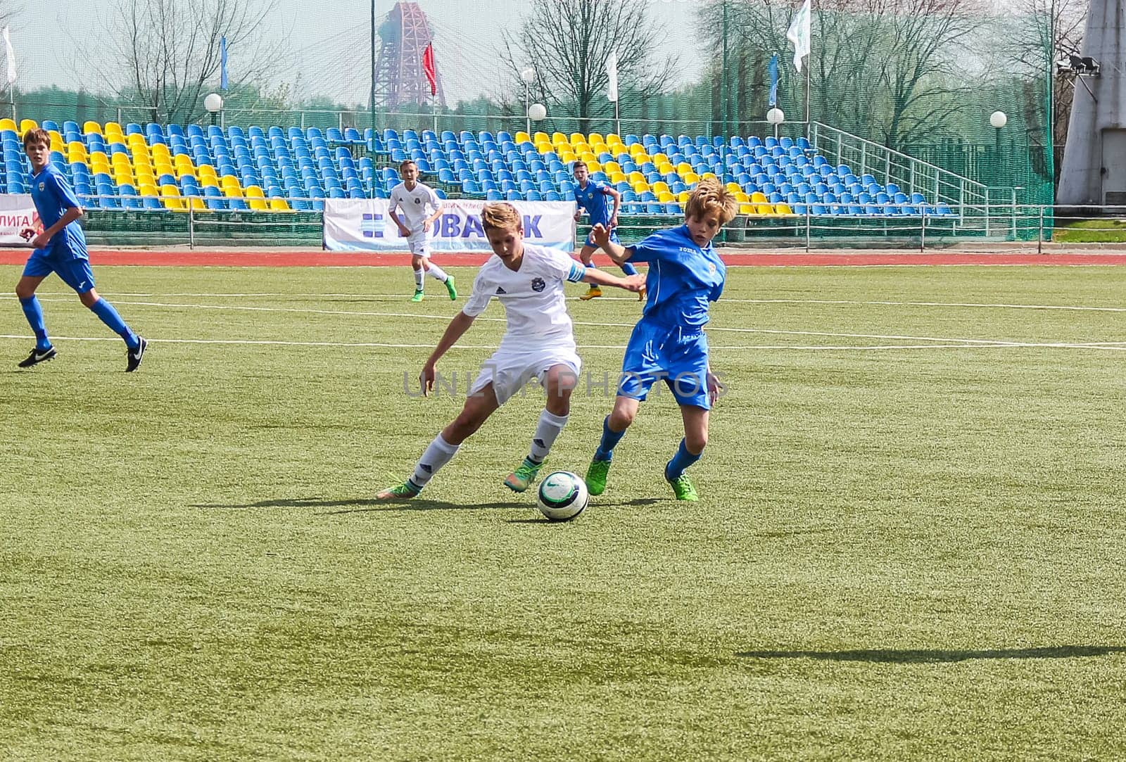 Russia, Volgodonsk - may 17, 2015: Football game. Training matches junior teams and fans