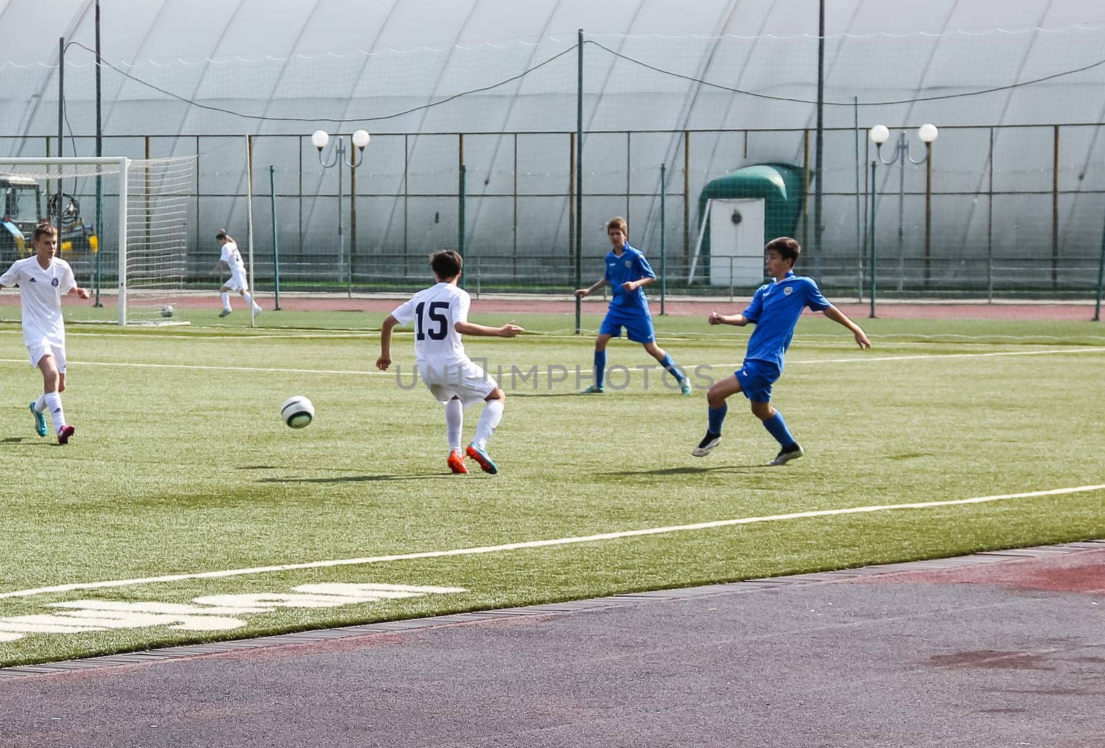 Russia, Volgodonsk - may 17, 2015: Football game. Training matches junior teams and fans