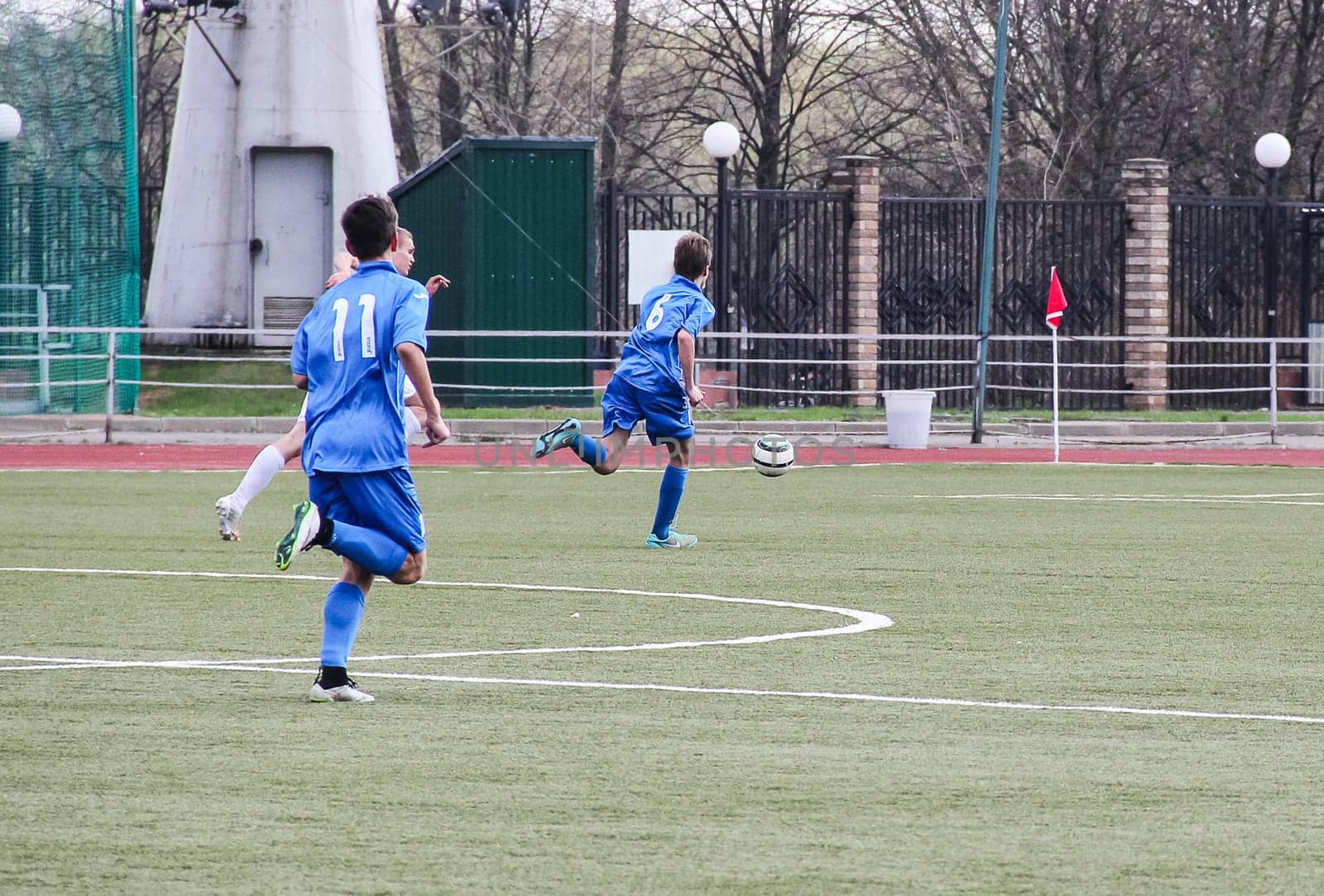 Russia, Volgodonsk - may 17, 2015: Football game. Training matches junior teams and fans