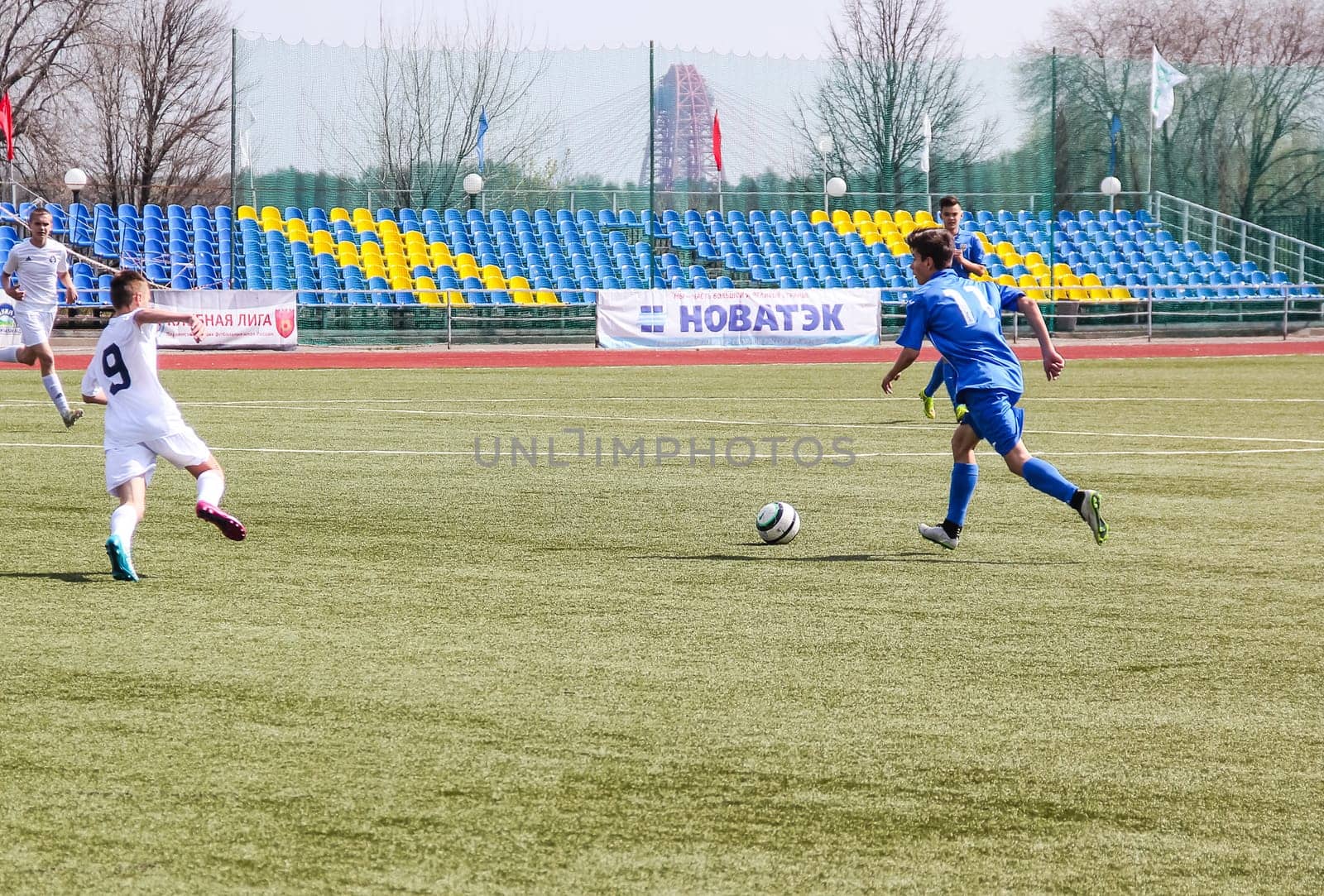 Russia, Volgodonsk - may 17, 2015: Football game. Training matches junior teams and fans