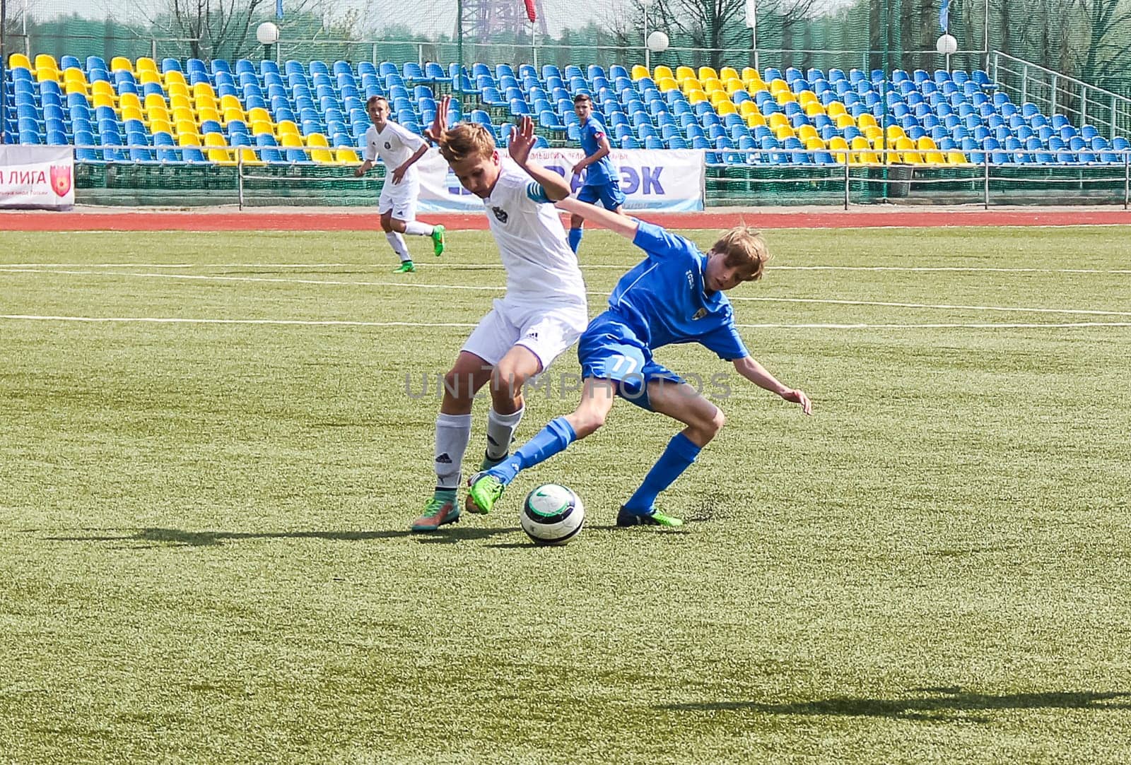 Russia, Volgodonsk - may 17, 2015: Football game. Training matches junior teams and fans