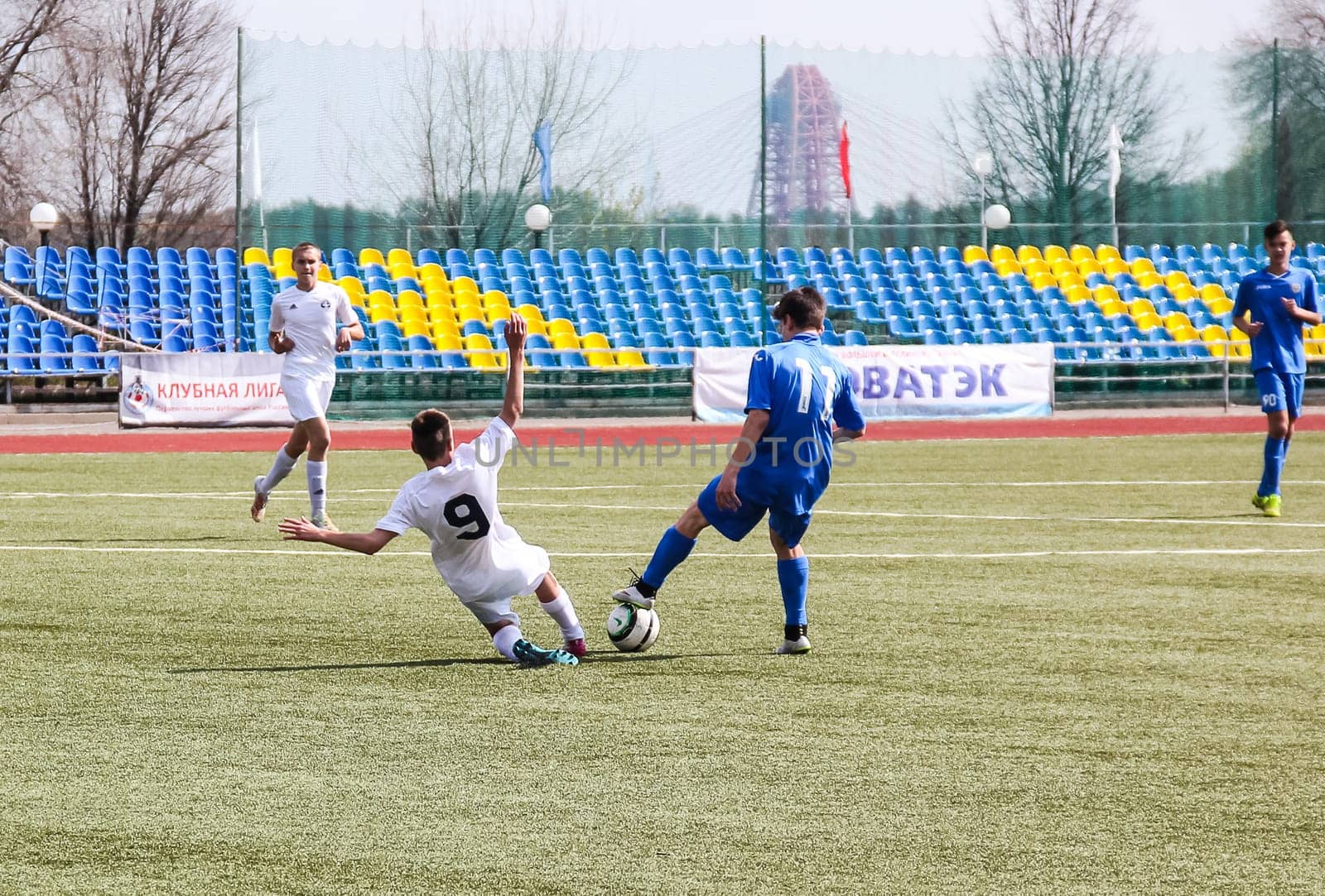 Russia, Volgodonsk - may 17, 2015: Football game. Training matches junior teams and fans