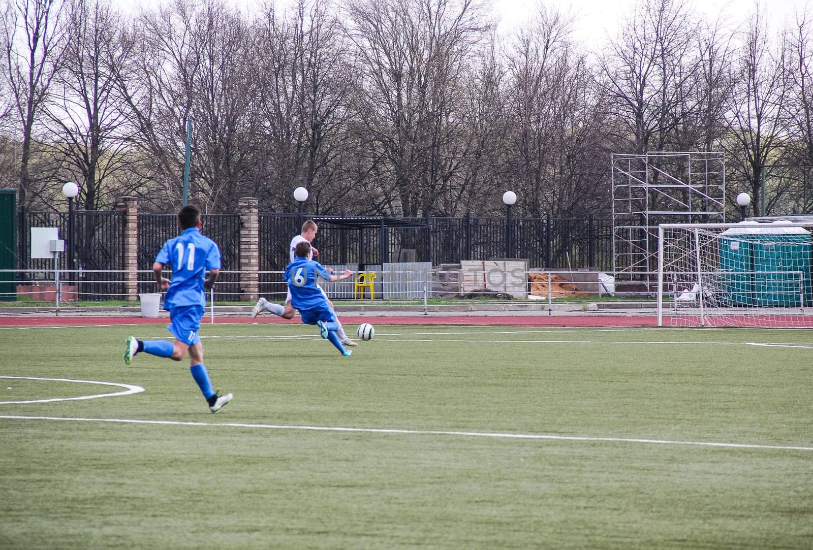 Russia, Volgodonsk - may 17, 2015: Football game. Training matches junior teams and fans