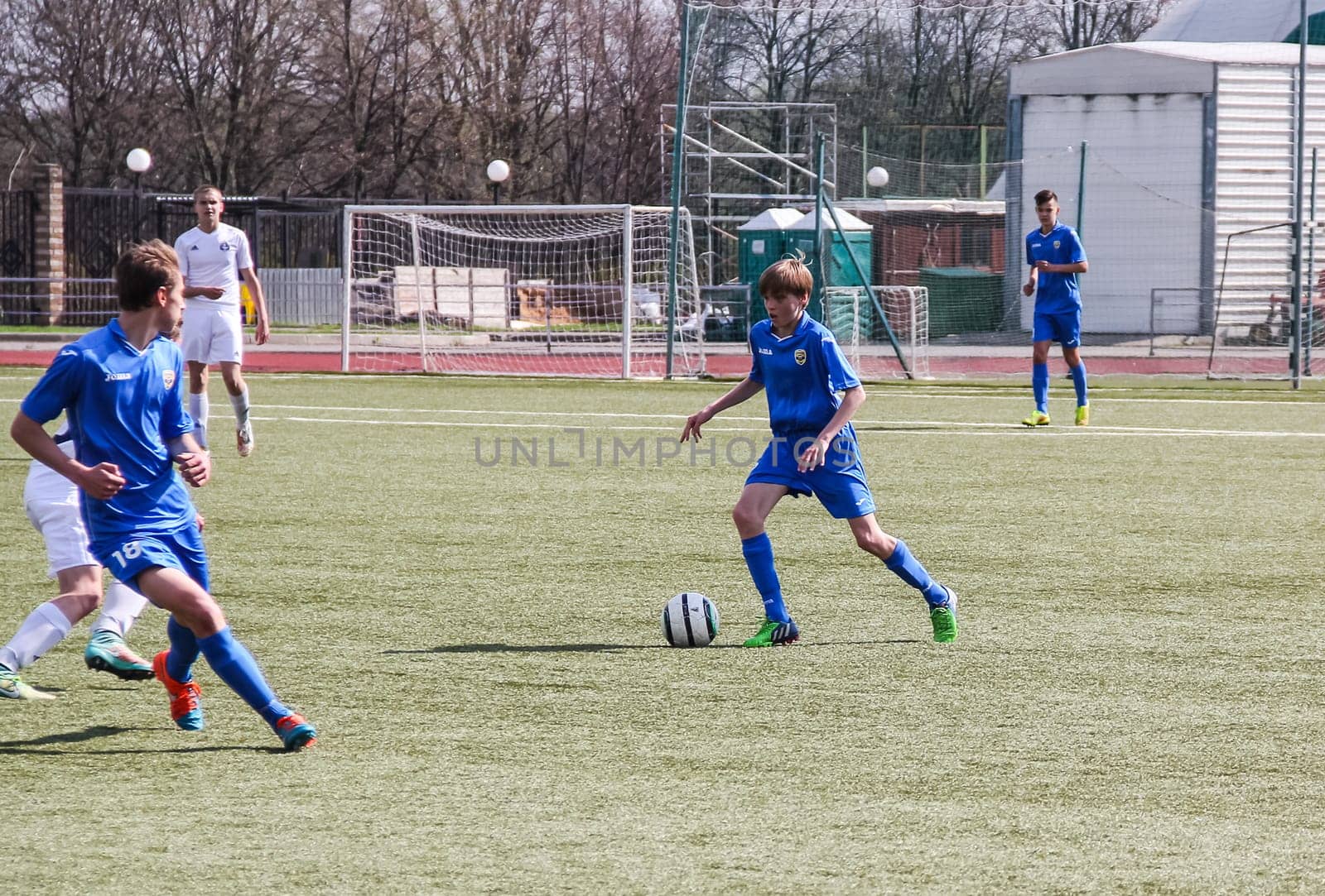 Russia, Volgodonsk - may 17, 2015: Football game. Training matches junior teams and fans