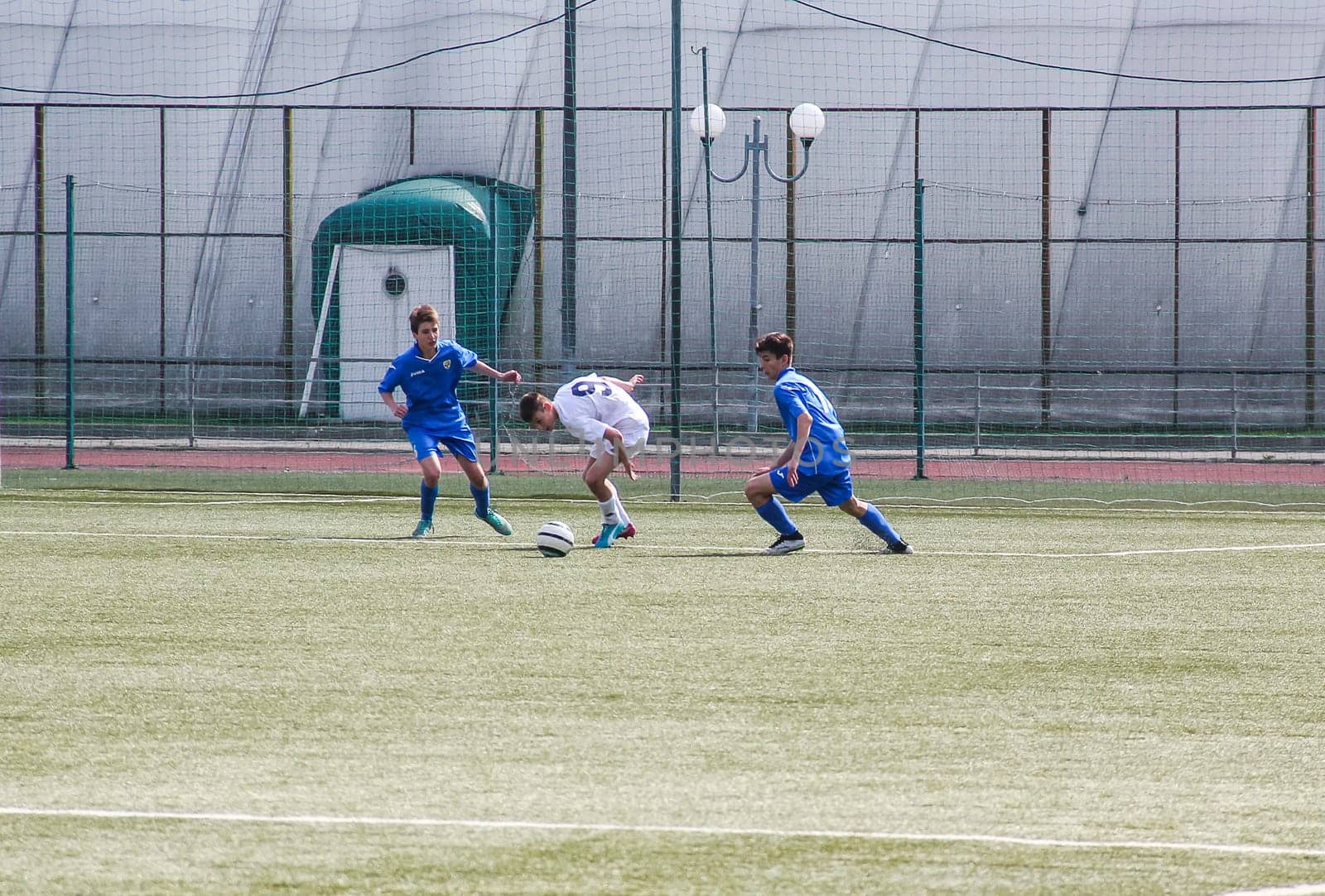 Russia, Volgodonsk - may 17, 2015: Football game. Training matches junior teams and fans