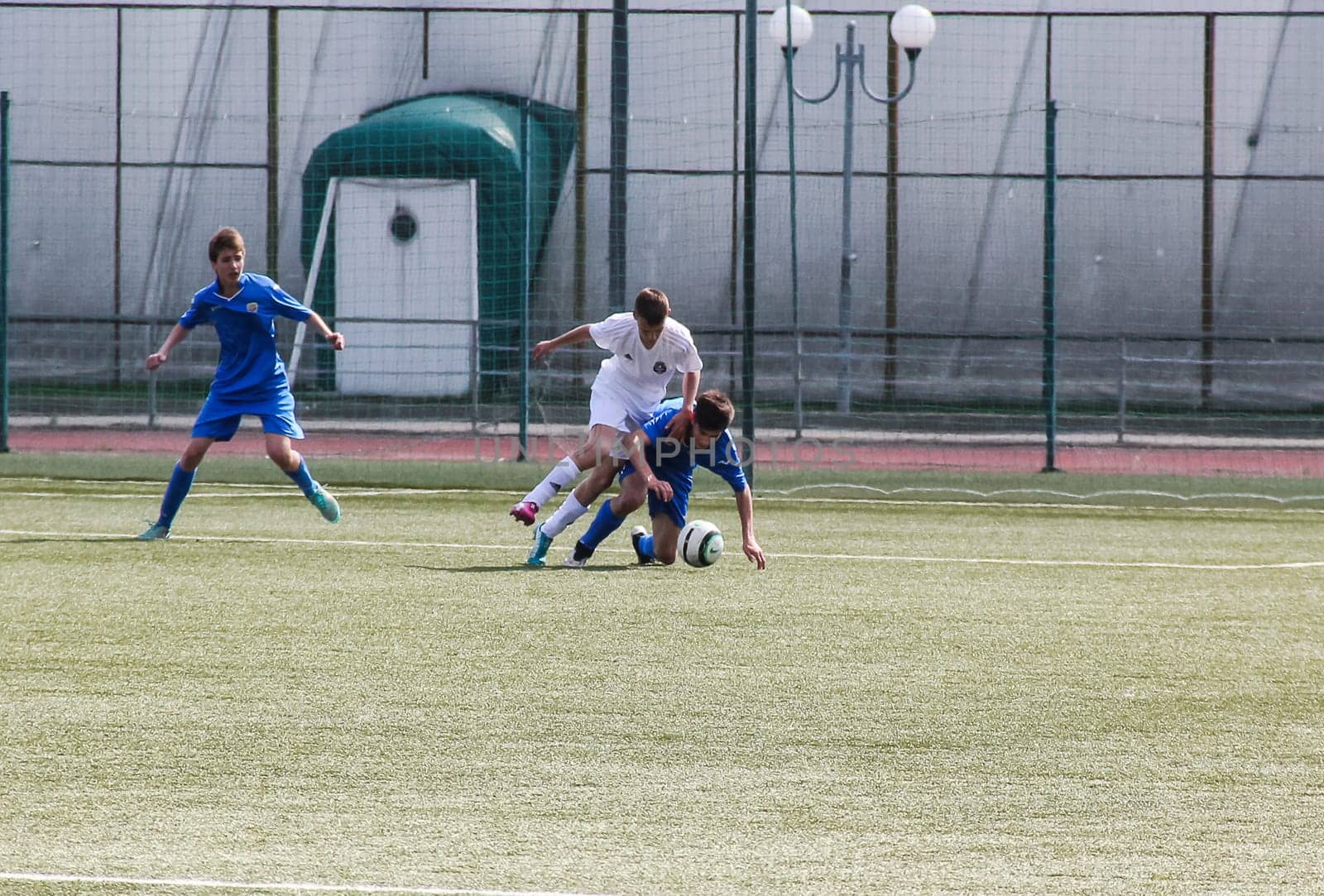 Russia, Volgodonsk - may 17, 2015: Football game. Training matches junior teams and fans