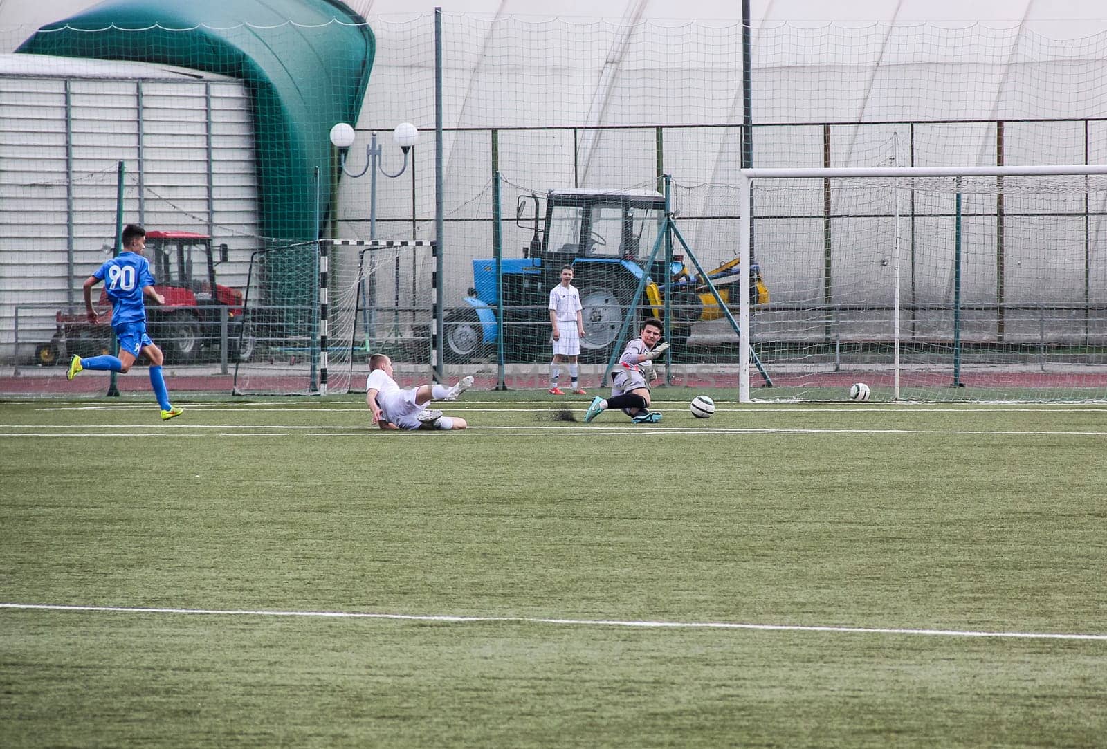 Russia, Volgodonsk - may 17, 2015: Football game. Training matches junior teams and fans