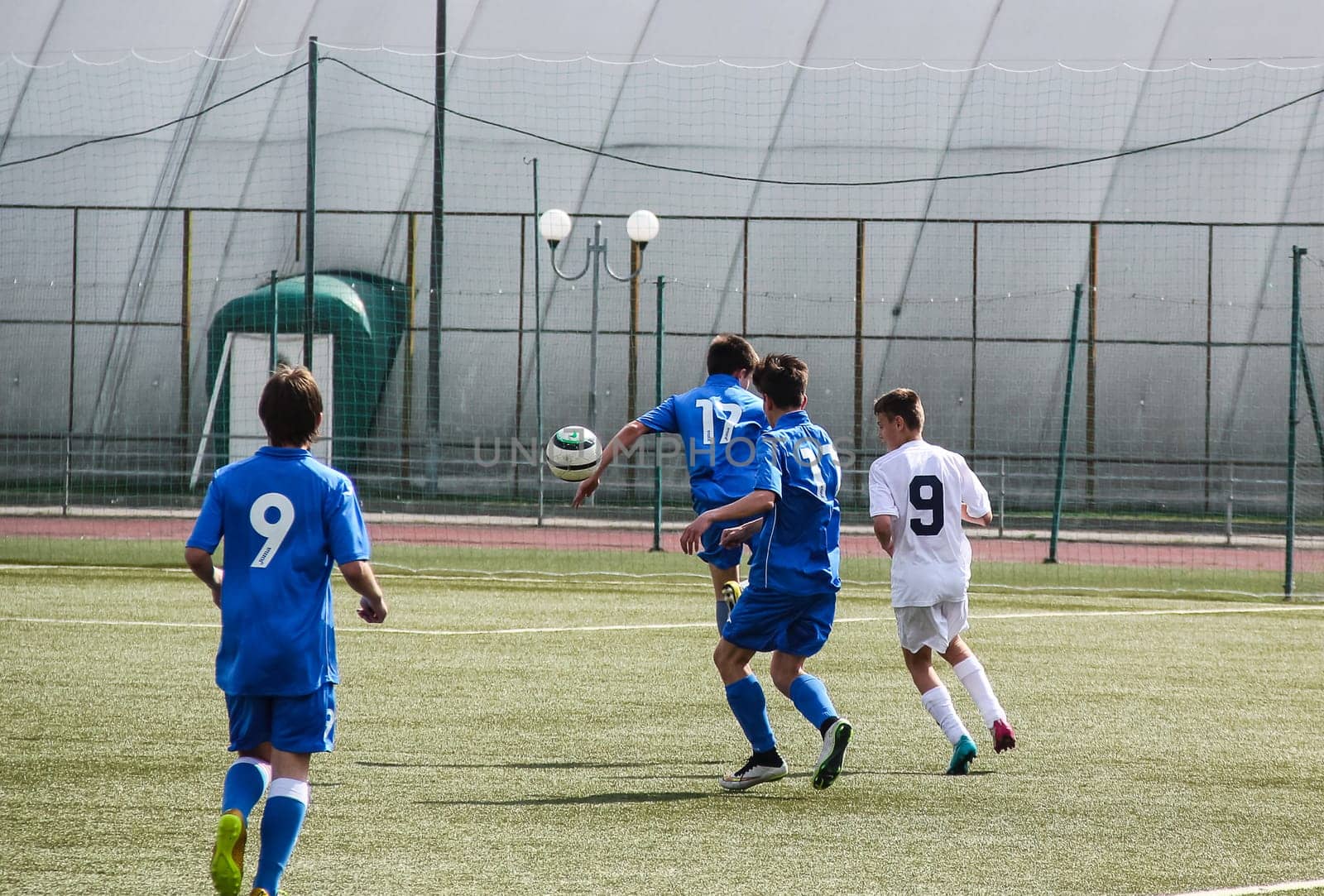 Russia, Volgodonsk - may 17, 2015: Football game. Training matches junior teams and fans