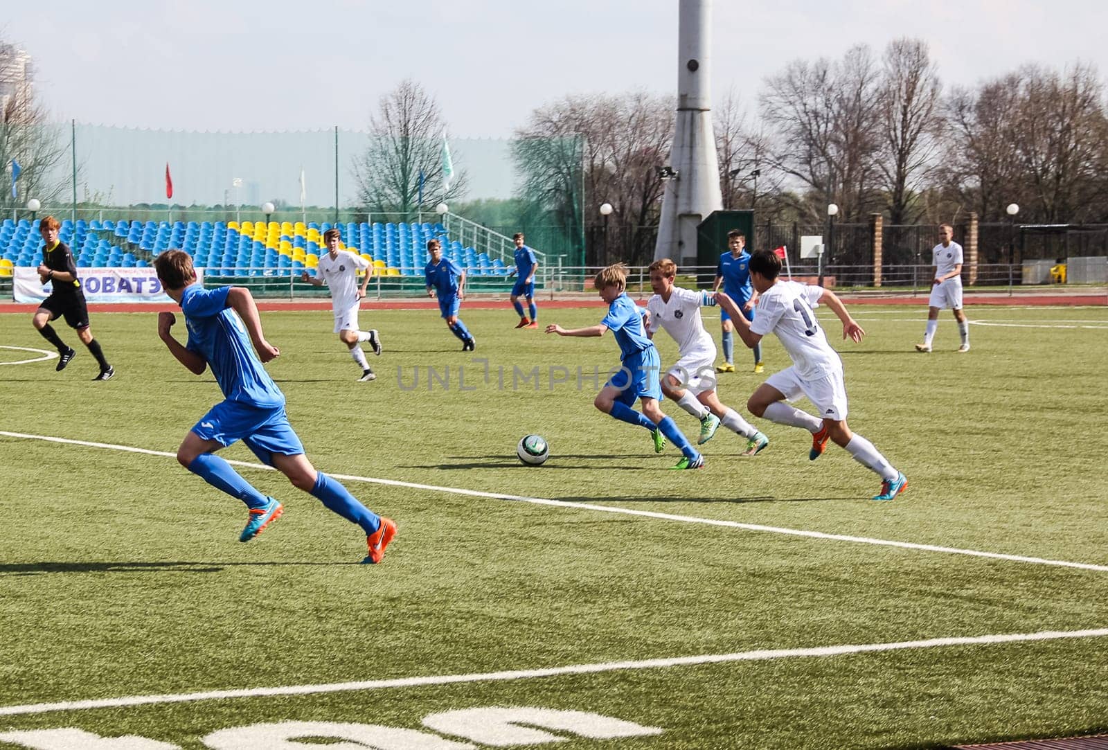 Russia, Volgodonsk - may 17, 2015: Football game. Training matches junior teams and fans