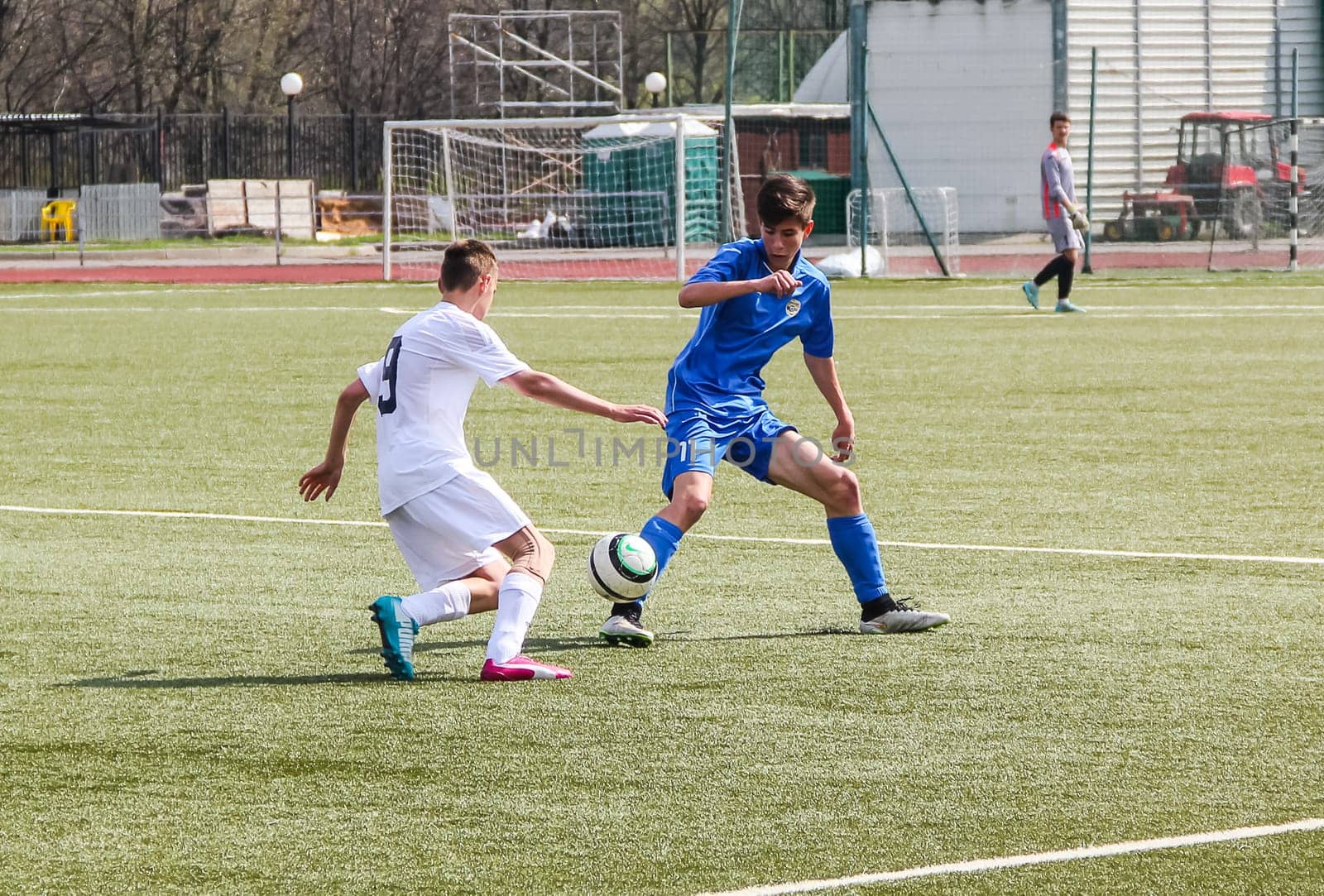 Russia, Volgodonsk - may 17, 2015: Football game. Training matches junior teams and fans