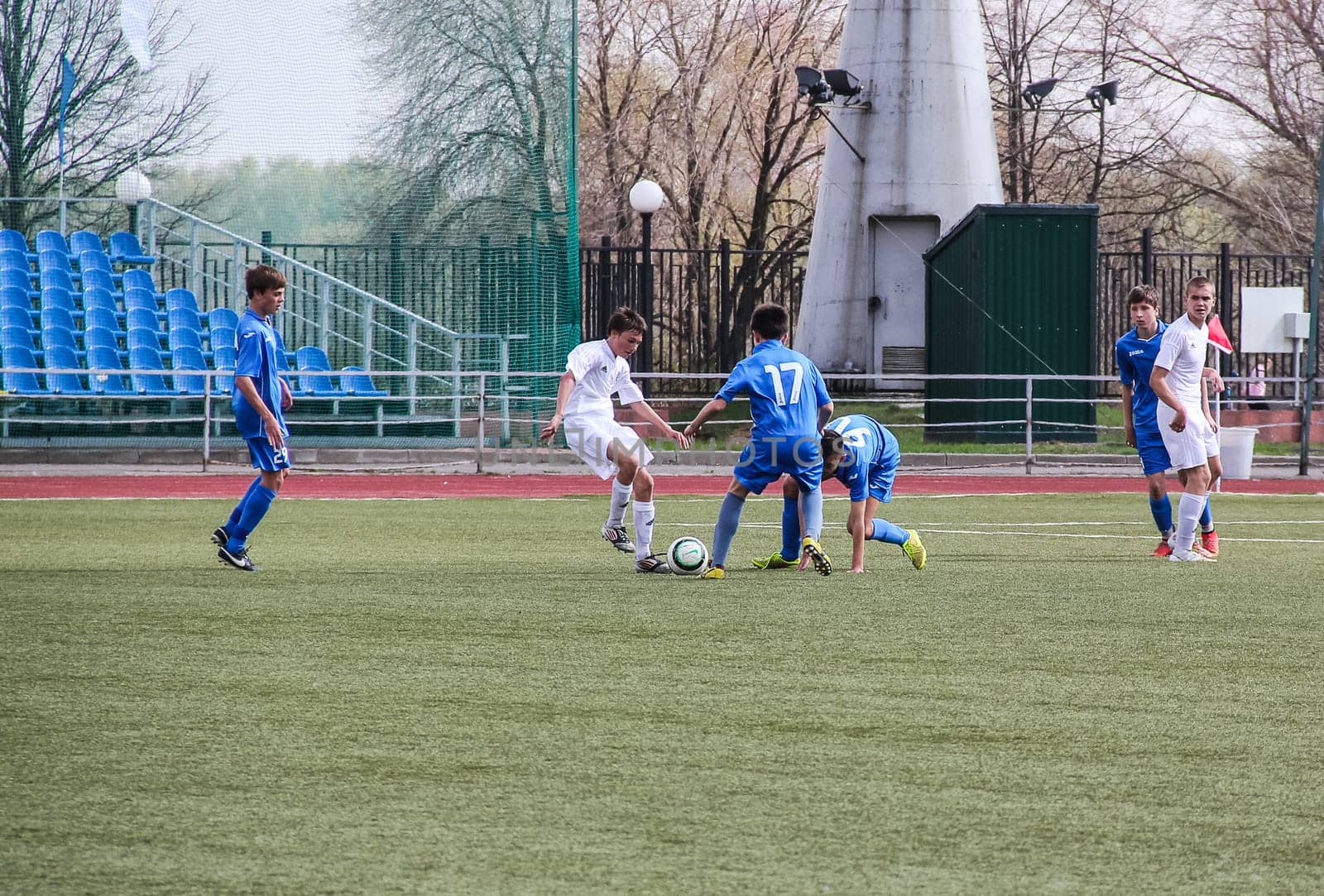 Russia, Volgodonsk - may 17, 2015: Football game. Training matches junior teams and fans
