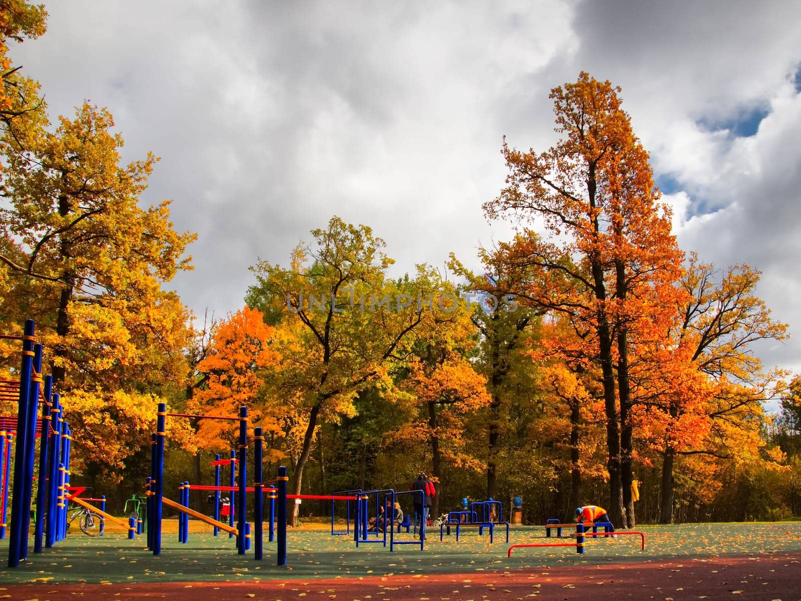 Outdoor sports infrastructure. Yard area with exercise machines and horizontal bars