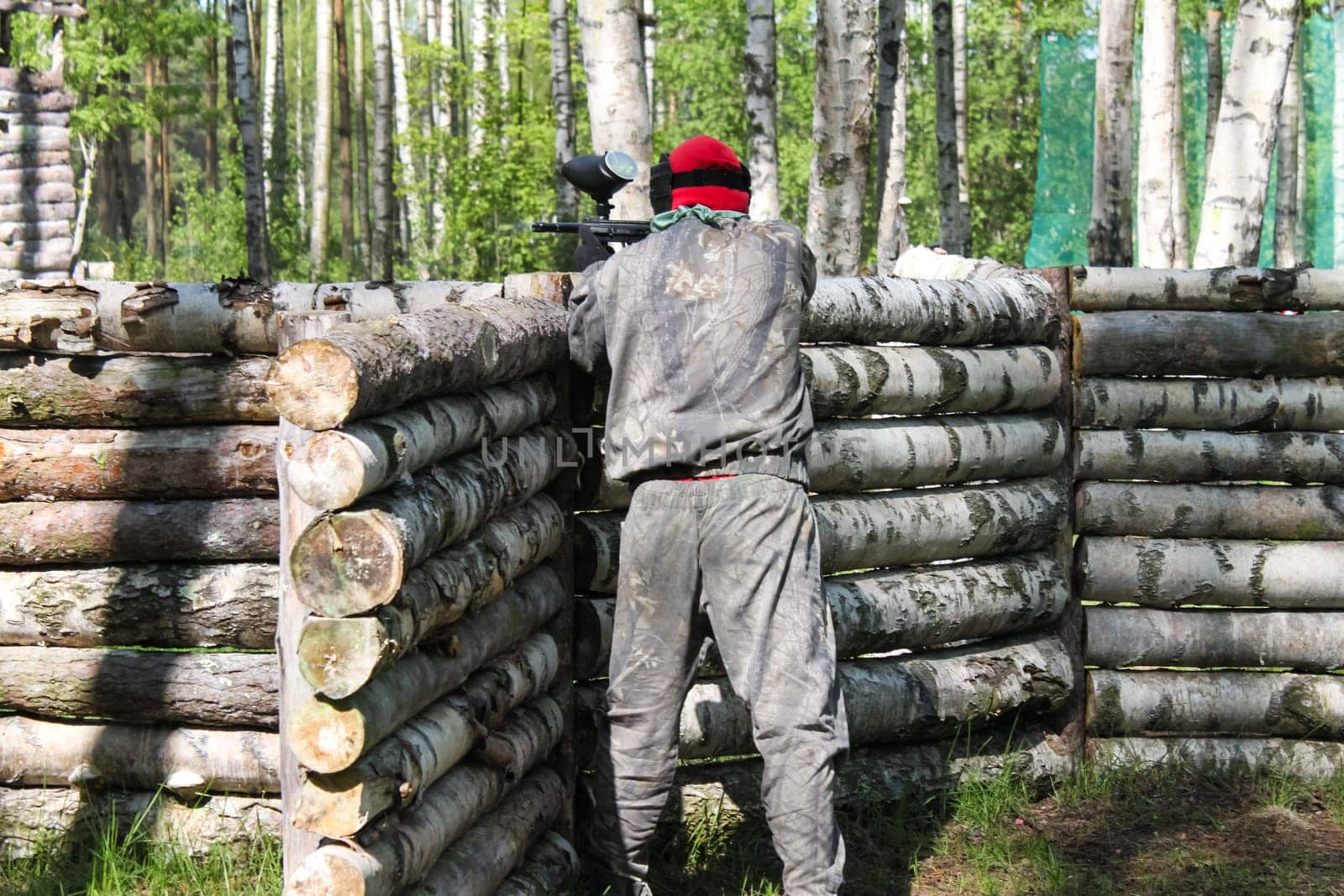 Russia, Volgodonsk - June 30, 2015: Paintball. Shooting competition of weapons with paint balls. Forest tournament