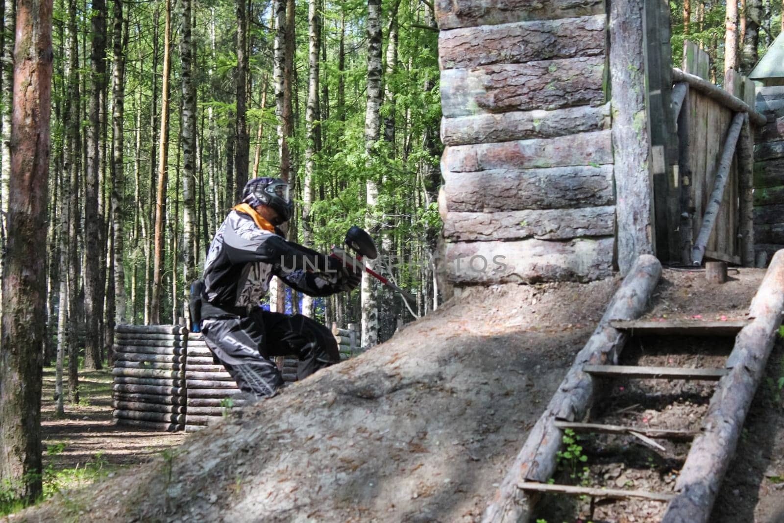 Russia, Volgodonsk - June 30, 2015: Paintball. Shooting competition of weapons with paint balls. Forest tournament