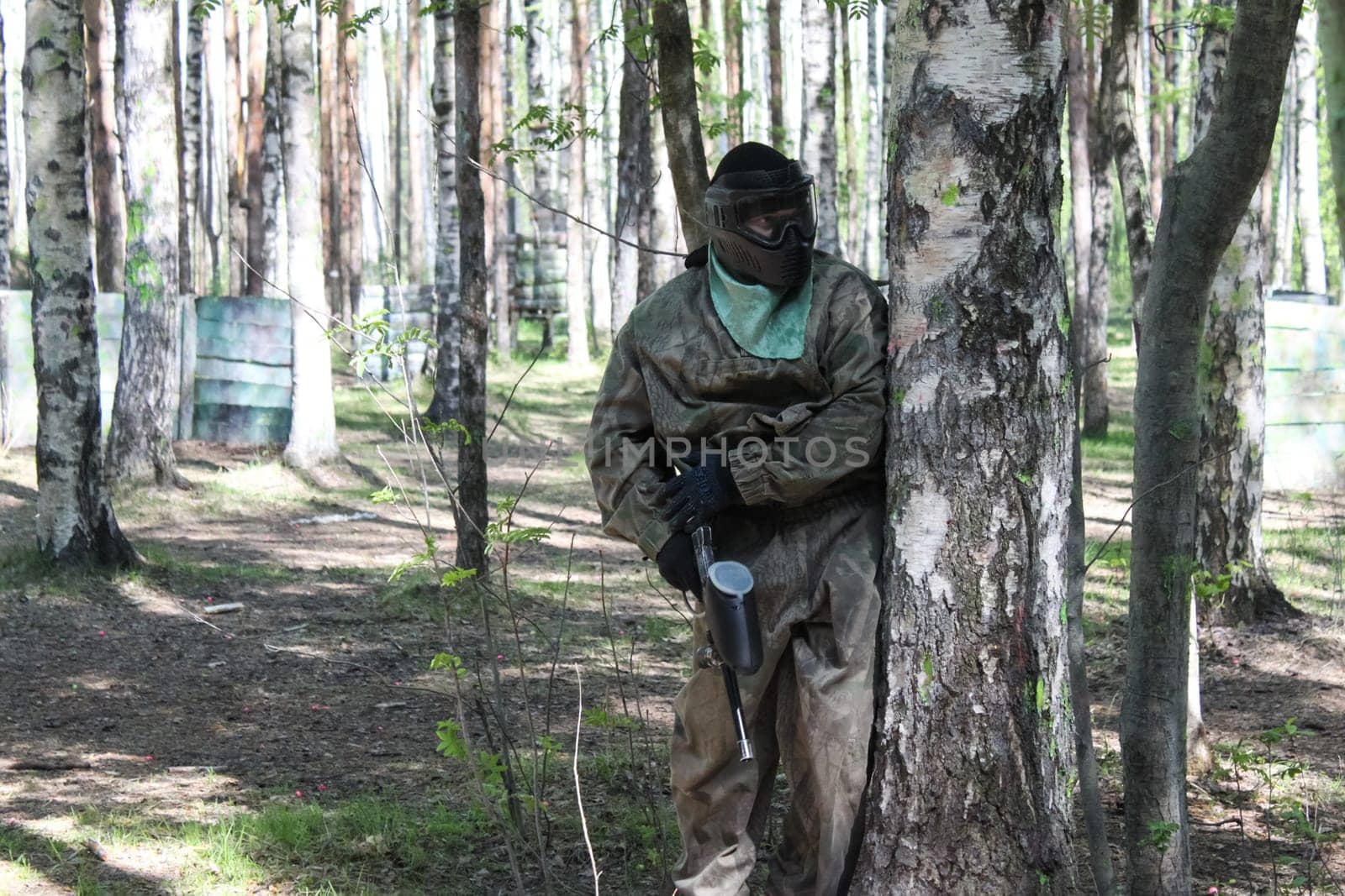 Russia, Volgodonsk - June 30, 2015: Paintball. Shooting competition of weapons with paint balls. Forest tournament