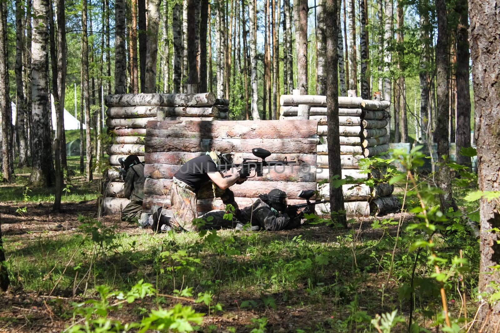 Russia, Volgodonsk - June 30, 2015: Paintball. Shooting competition of weapons with paint balls. Forest tournament