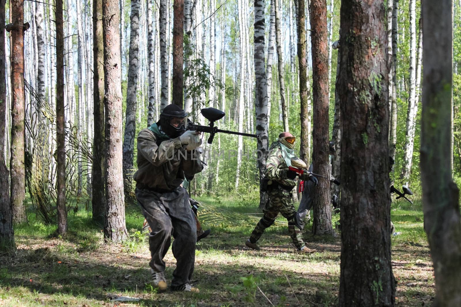Russia, Volgodonsk - June 30, 2015: Paintball. Shooting competition of weapons with paint balls. Forest tournament
