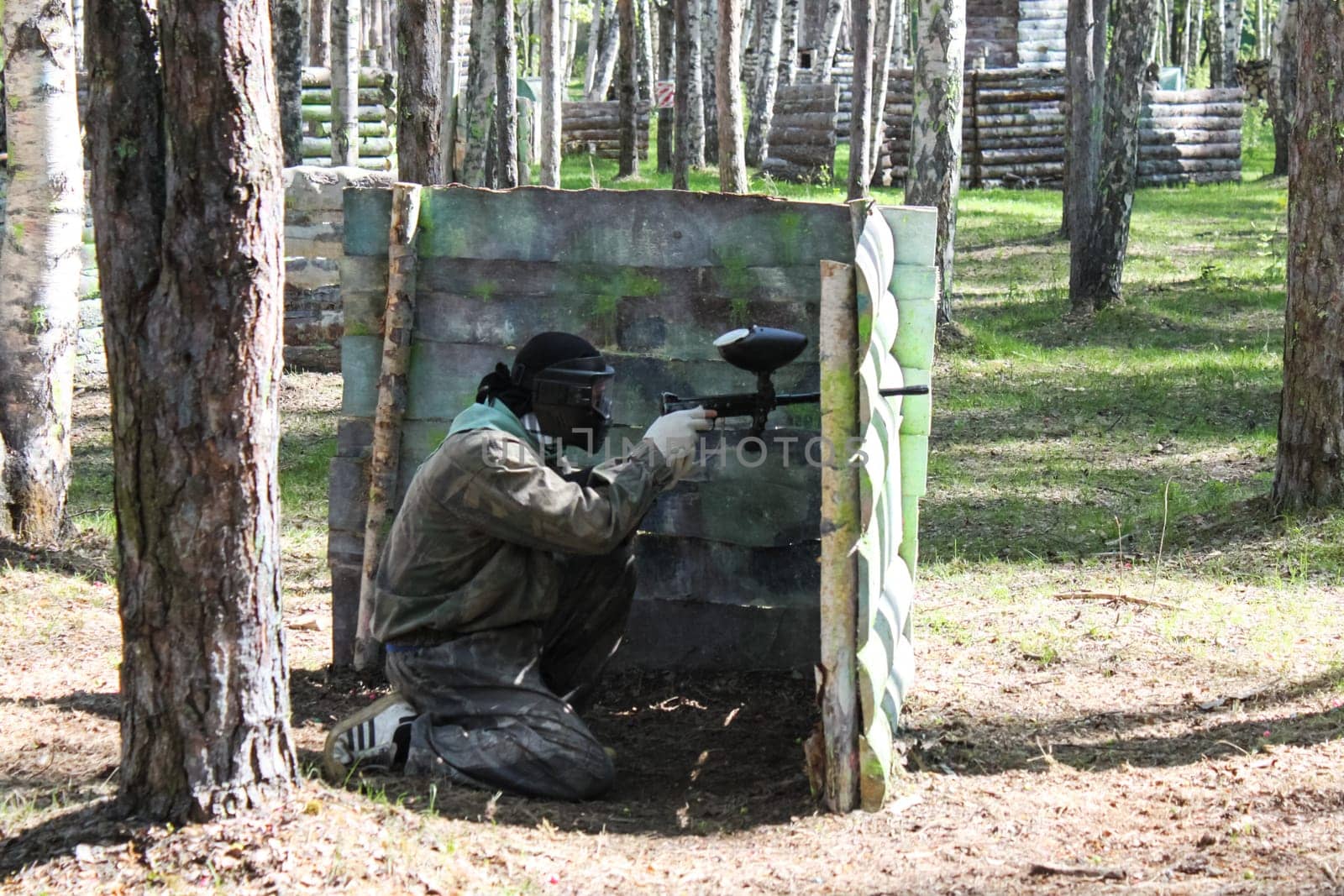 Russia, Volgodonsk - June 30, 2015: Paintball. Shooting competition of weapons with paint balls. Forest tournament