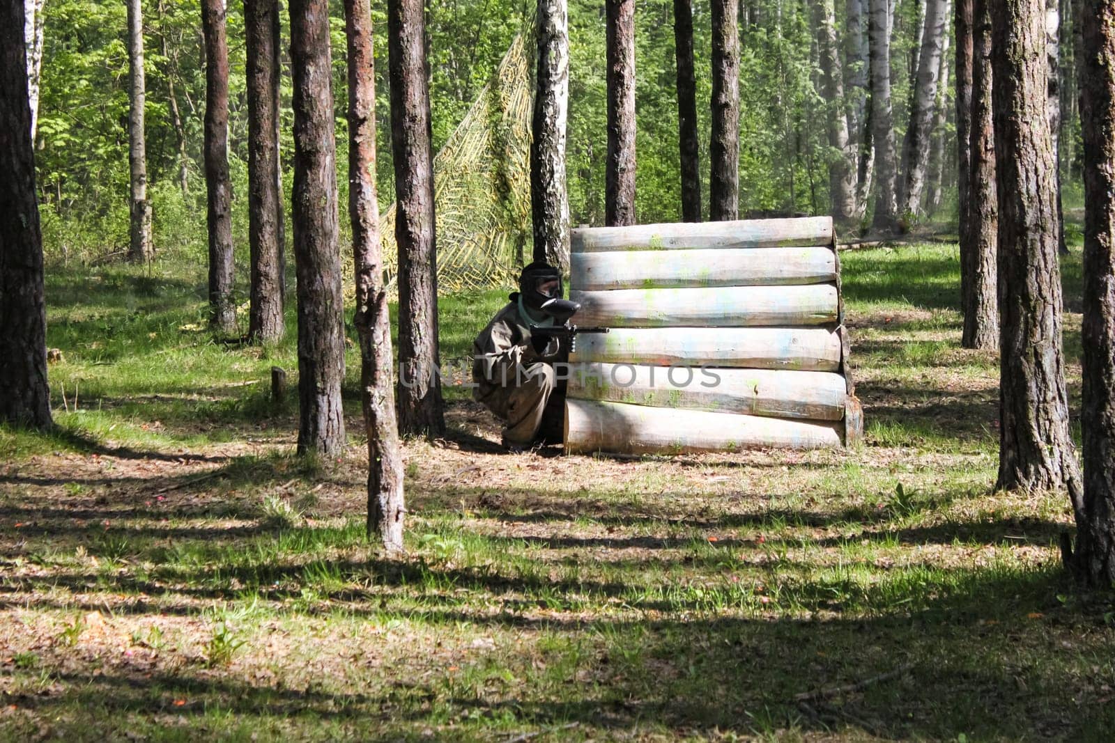 Russia, Volgodonsk - June 30, 2015: Paintball. Shooting competition of weapons with paint balls. Forest tournament