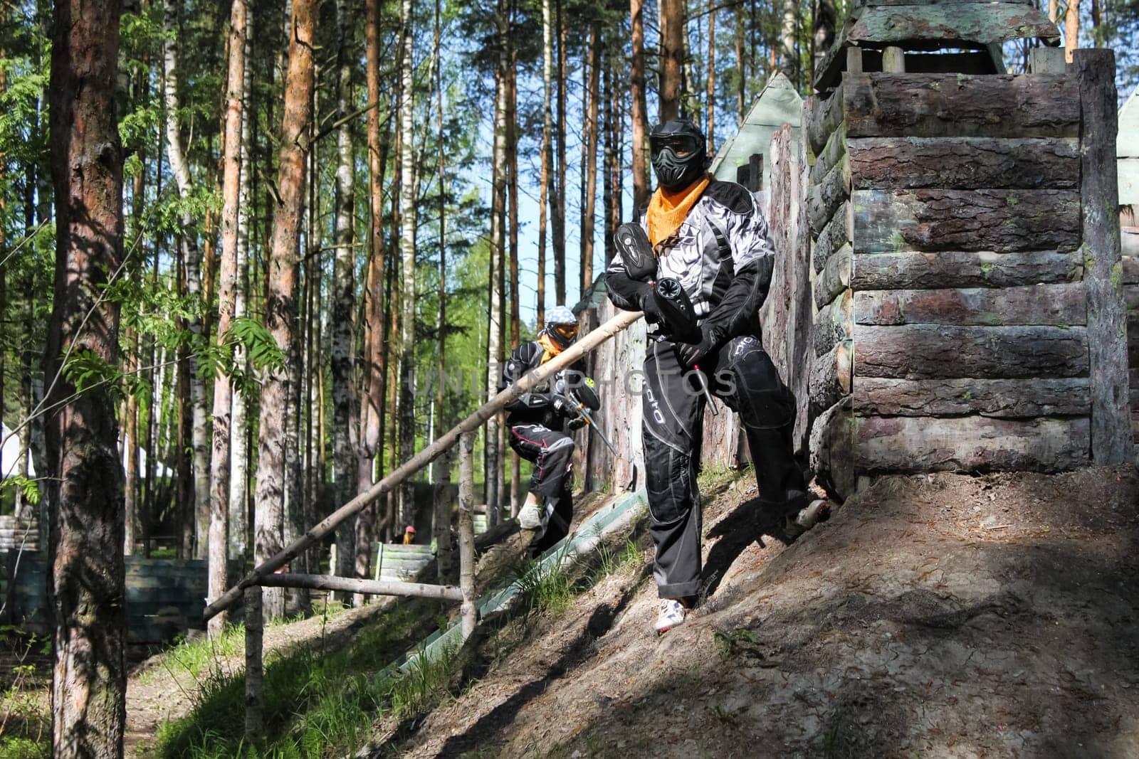 Russia, Volgodonsk - June 30, 2015: Paintball. Shooting competition of weapons with paint balls. Forest tournament