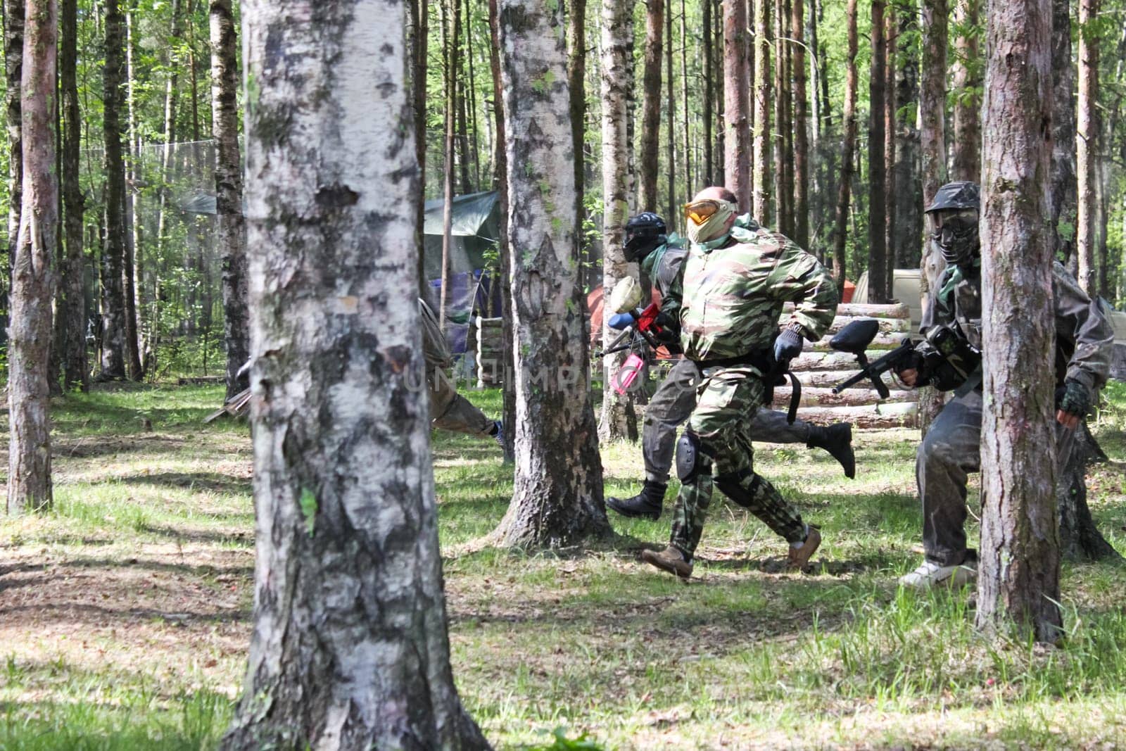 Russia, Volgodonsk - June 30, 2015: Paintball. Shooting competition of weapons with paint balls. Forest tournament
