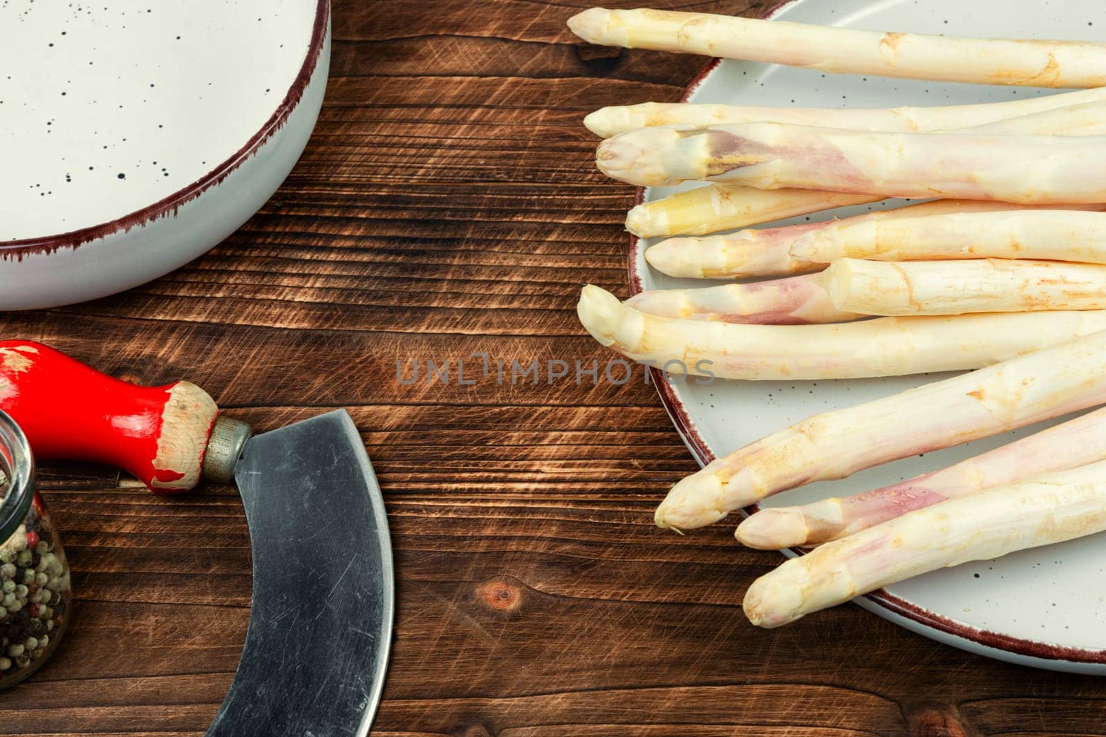 Bunch of uncooked fresh white asparagus. Seasonal spring vegetable for healthy food.