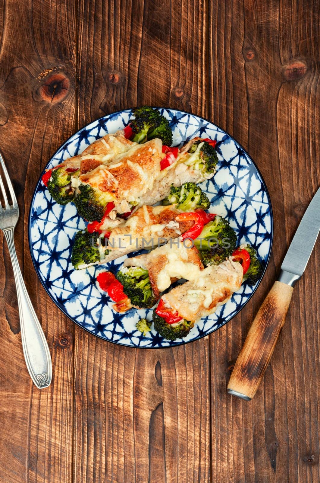 Meat rolls or roulades stuffed with broccoli and peppers. Meat with vegetable filling.