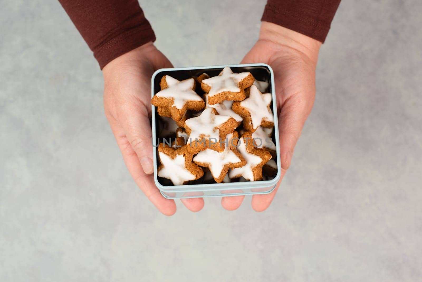 Cinnamon stars, Zimtsterne traditional german christmas cookies in a box , gingerbread with anise spice for holidays