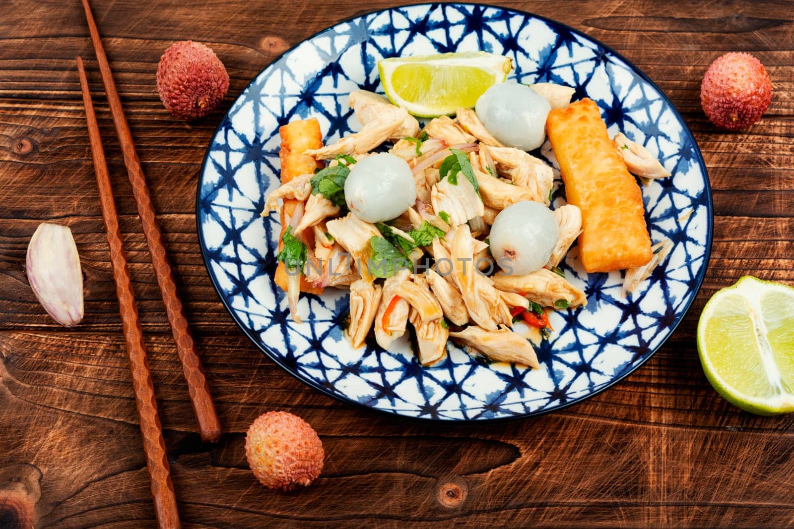 Tasty salad with peeled lychee and chicken breast. Healthy salad.