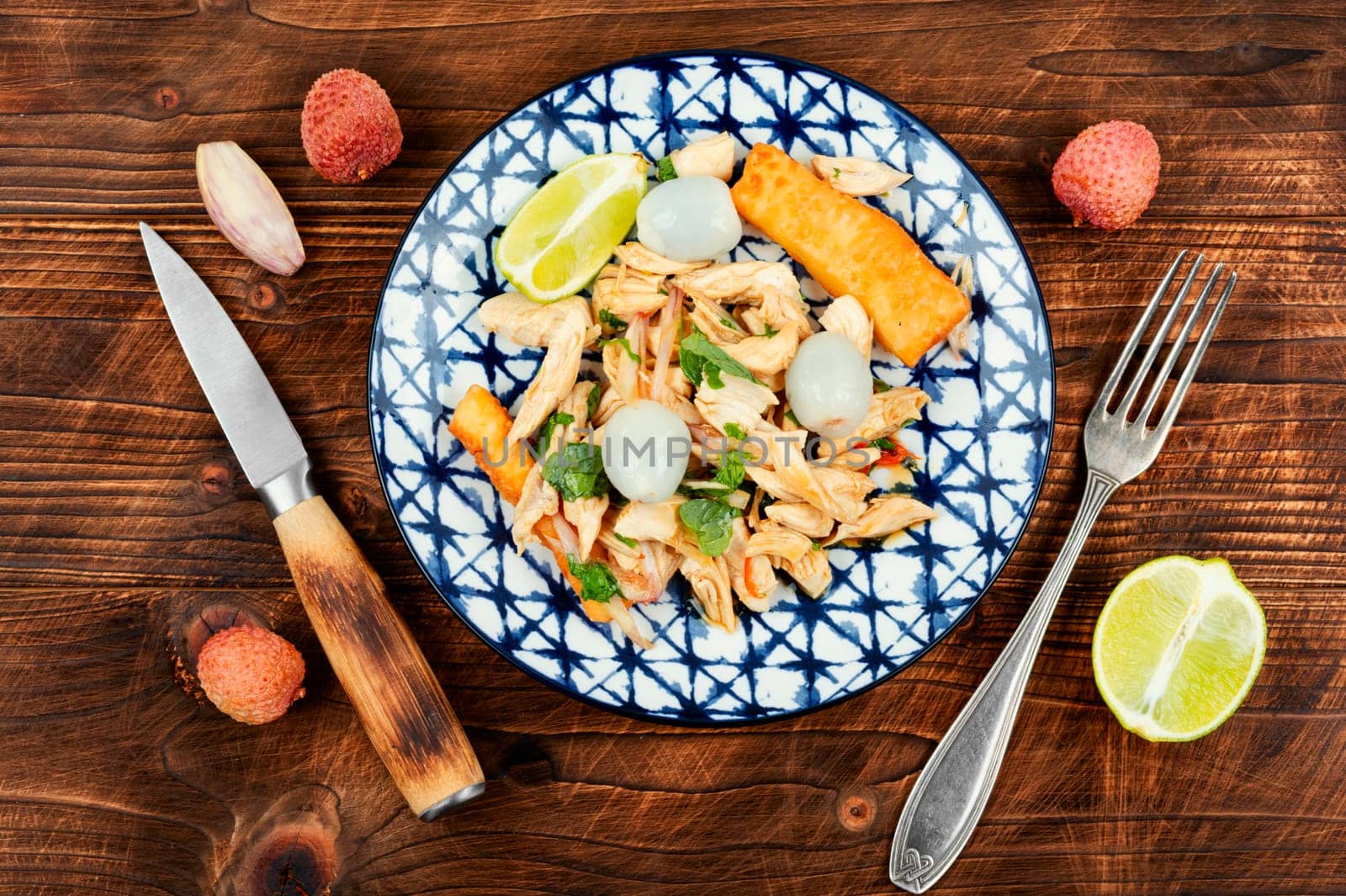 Tasty salad with peeled lychee and chicken breast. Healthy salad.