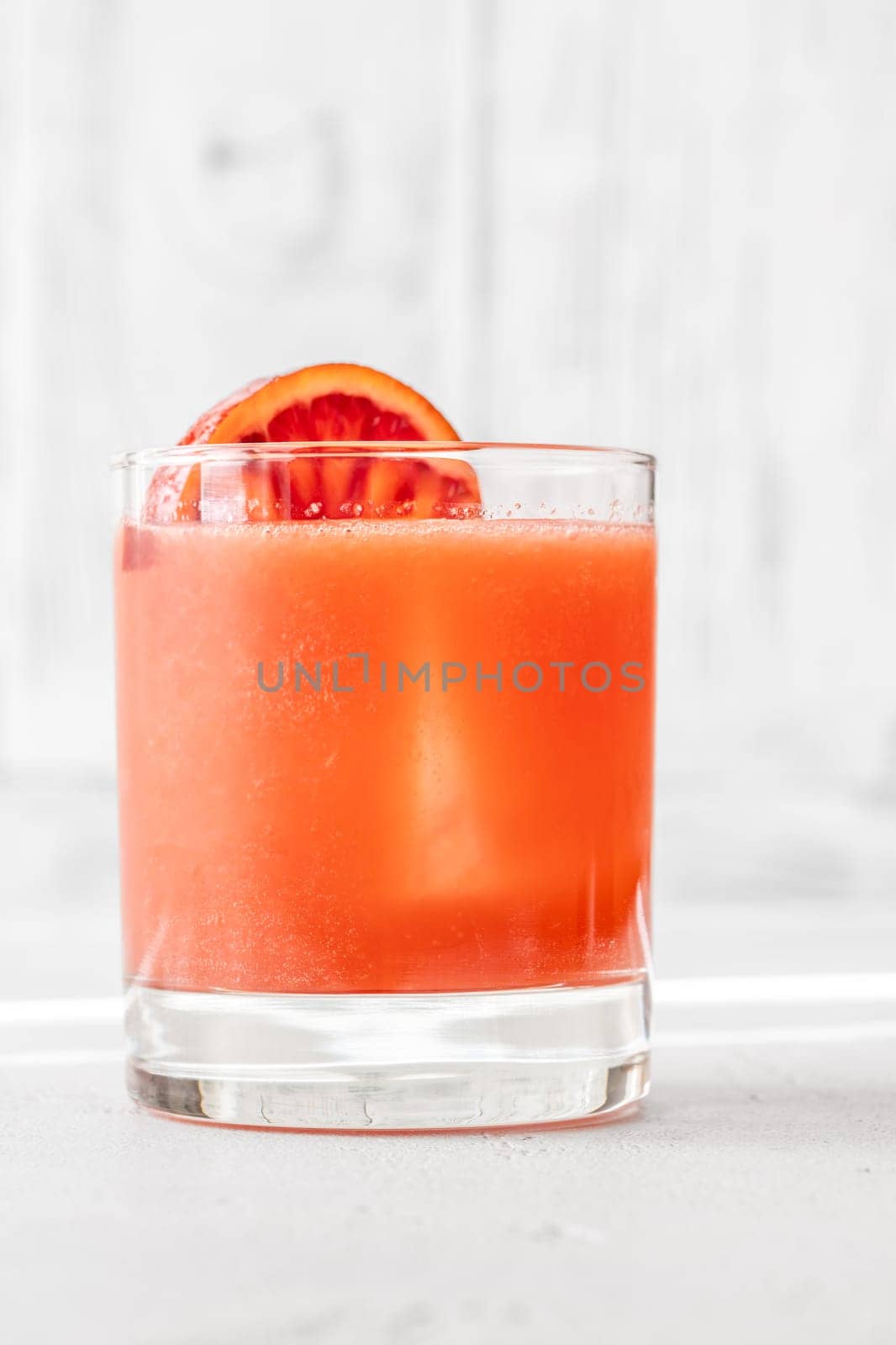 Sicilian Negroni cocktail garnished with orange wheel