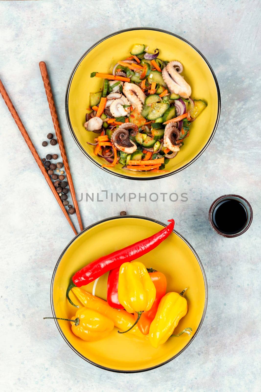 Salad of cucumber, onion and octopus. Korean food. Korean cuisine with seafood. Copy space.