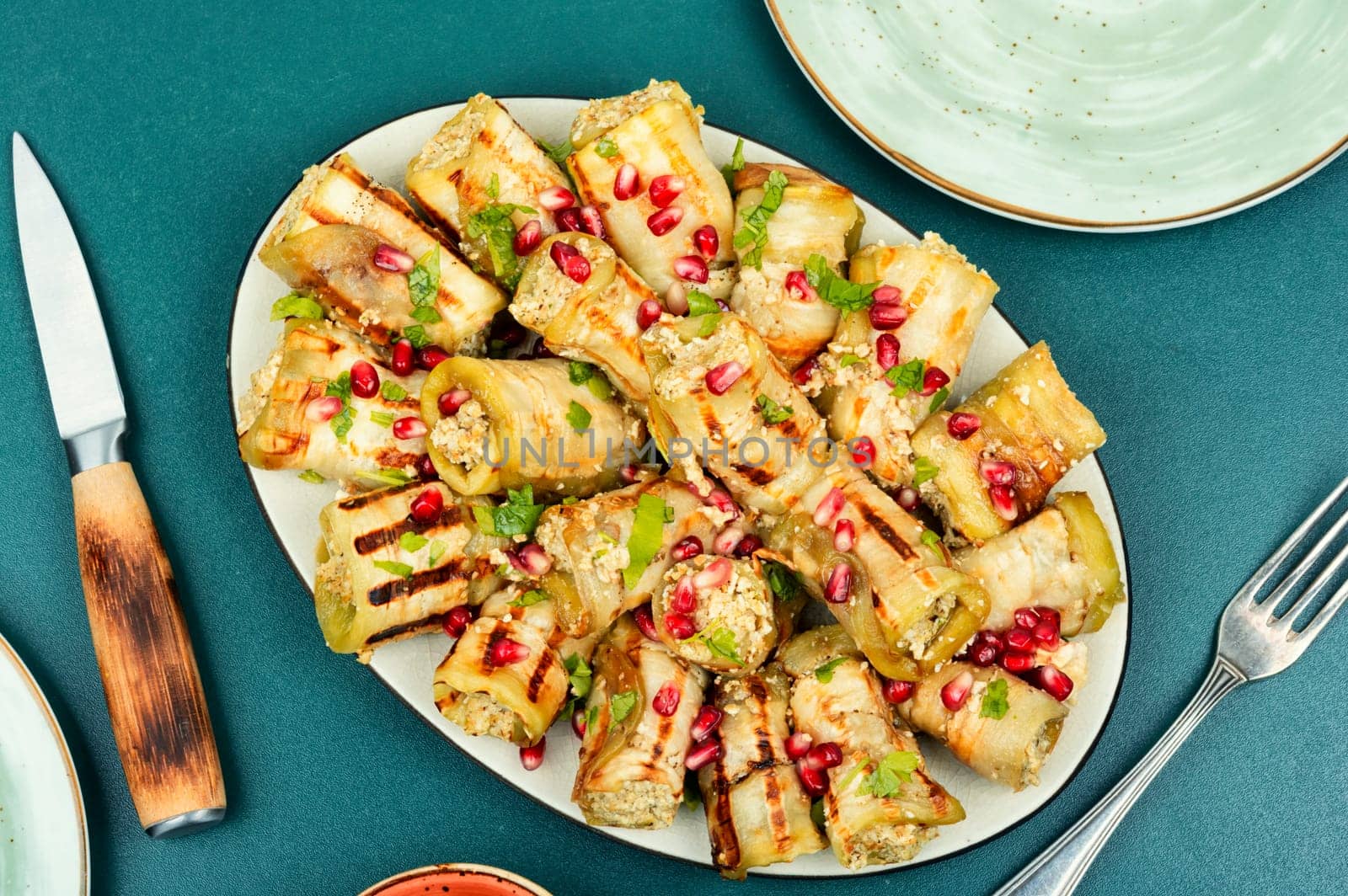 Georgian eggplant rolls with walnut and meat filling, badrijani. Top view.