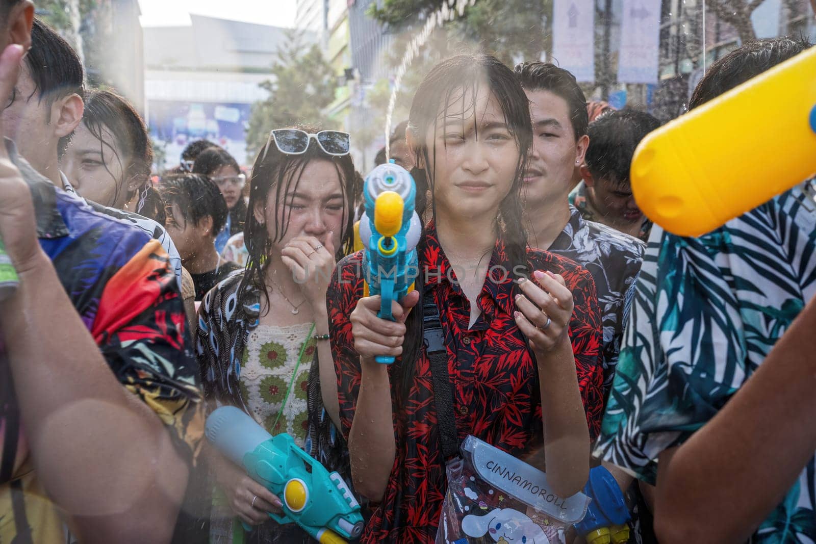 Siam Square, Bangkok, Thailand - APR 13, 2024 Songkran Festival, The short action of people joins celebrations of the Thai New Year or Songkran in Siam Square Bangkok, Thailand.
