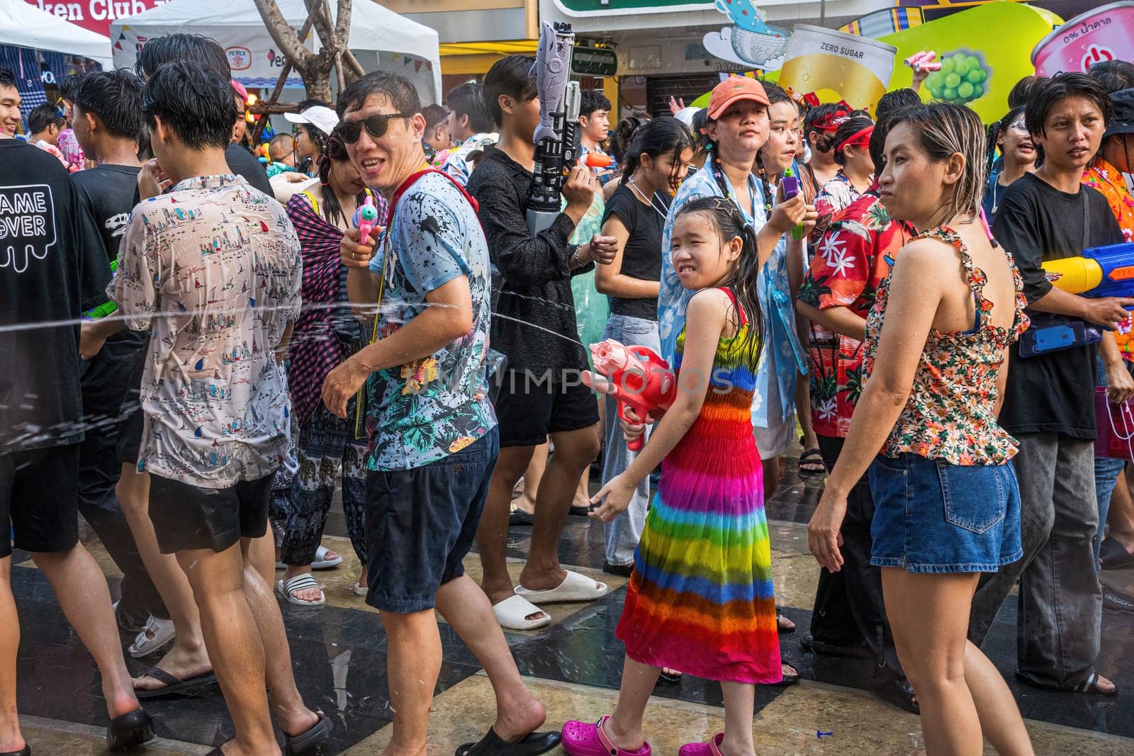 Siam Square, Bangkok, Thailand - APR 13, 2024 Songkran Festival, The short action of people joins celebrations of the Thai New Year or Songkran in Siam Square Bangkok, Thailand.