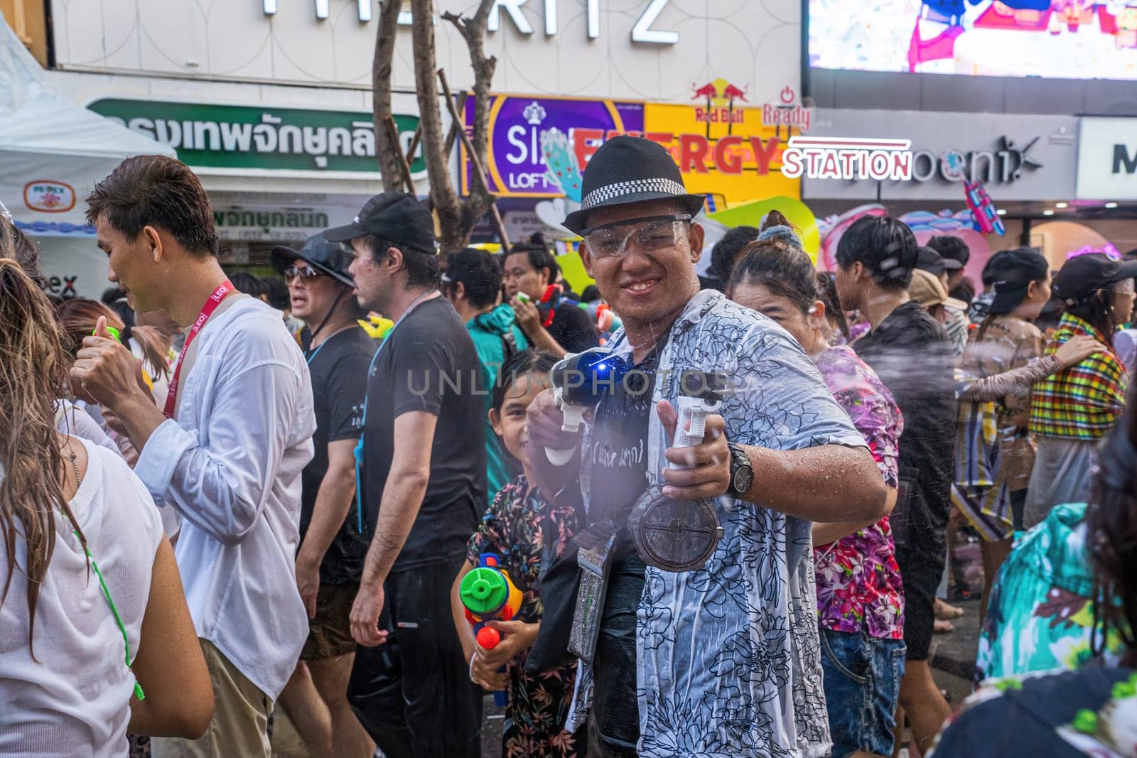 Siam Square, Bangkok, Thailand - APR 13, 2024 Songkran Festival, The short action of people joins celebrations of the Thai New Year or Songkran in Siam Square Bangkok, Thailand.