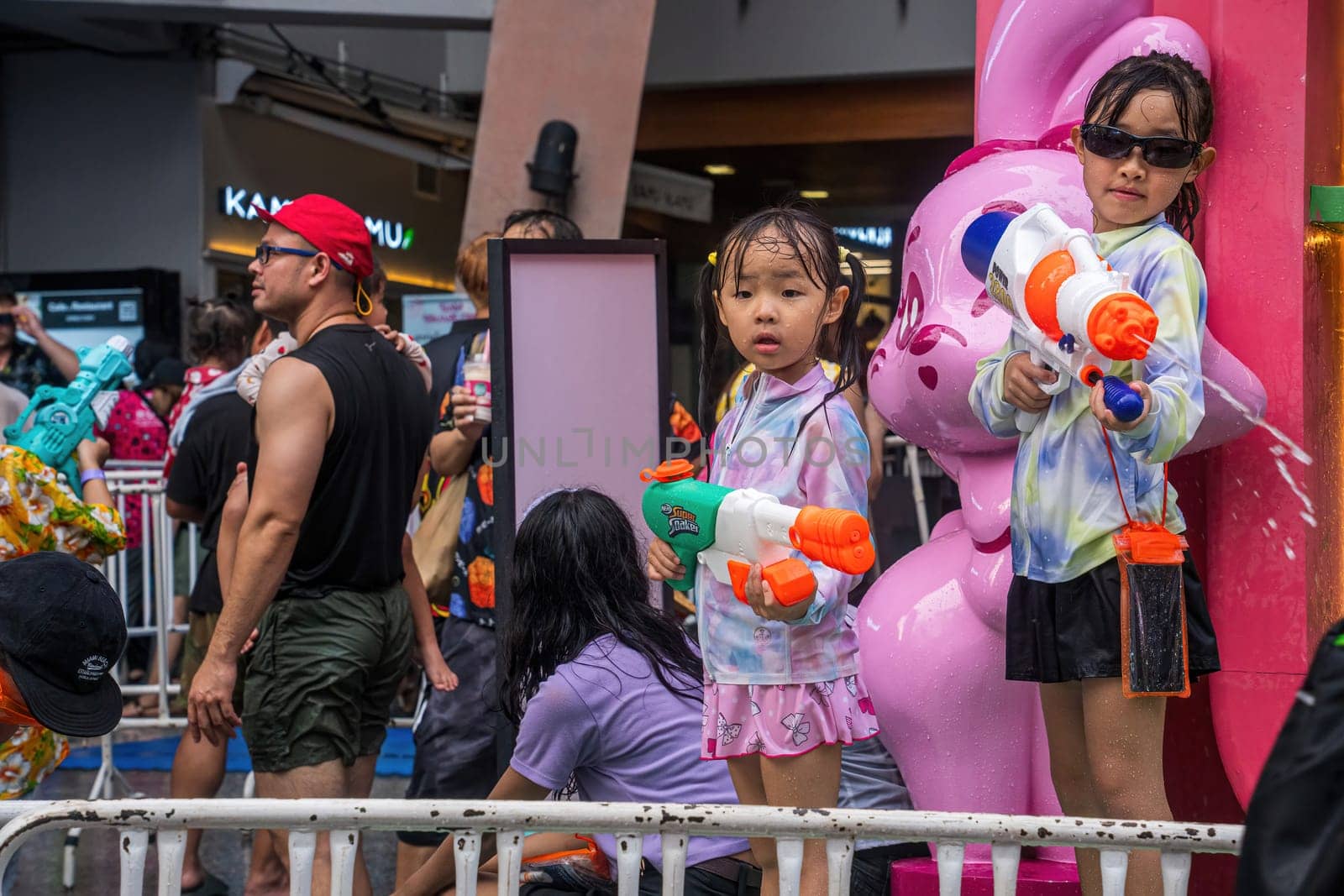 Siam Square, Bangkok, Thailand - APR 13, 2024 Songkran Festival, The short action of people joins celebrations of the Thai New Year or Songkran in Siam Square Bangkok, Thailand.